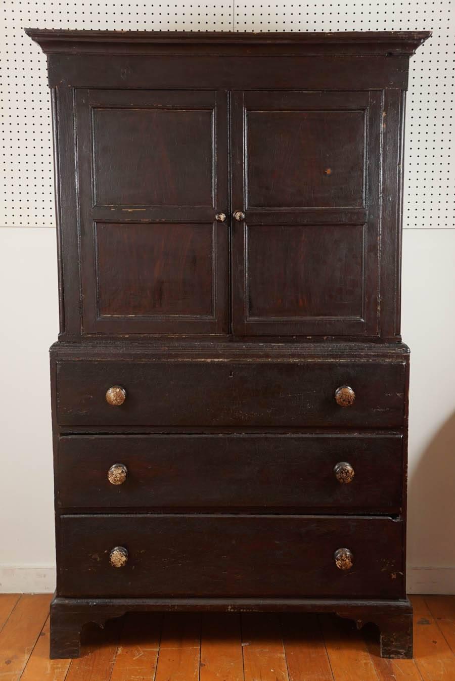 This absolutely original Welsh cupboard is a fabulous find. The two-paneled doors open to a divided cupboard, perfect for storage or a flat screen television. The three large drawers below are wonderful for clothing or linens. This piece is clean