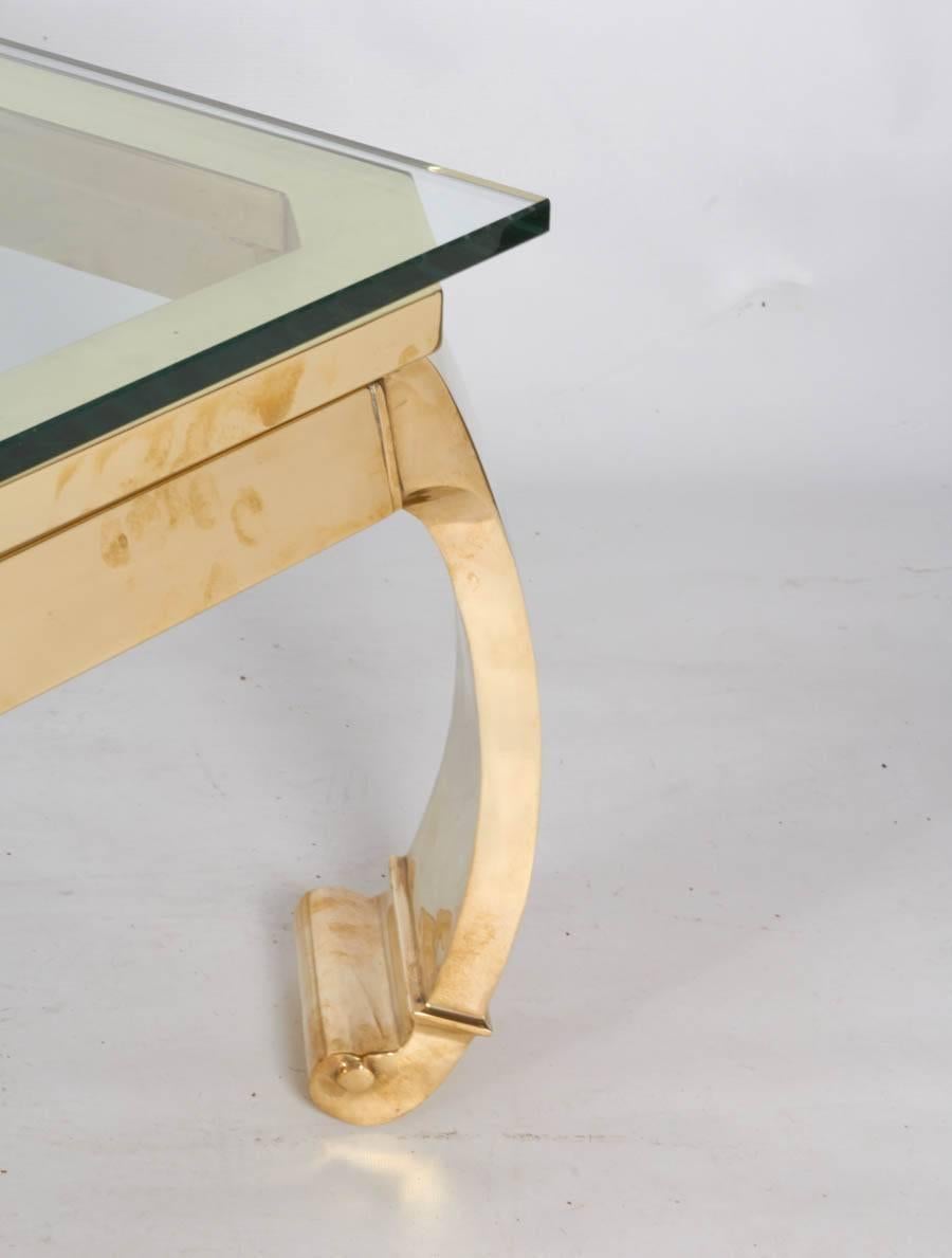 Gorgeous solid brass coffee table with beautiful chinoiserie lines and a polished glamour! Please contact for location.