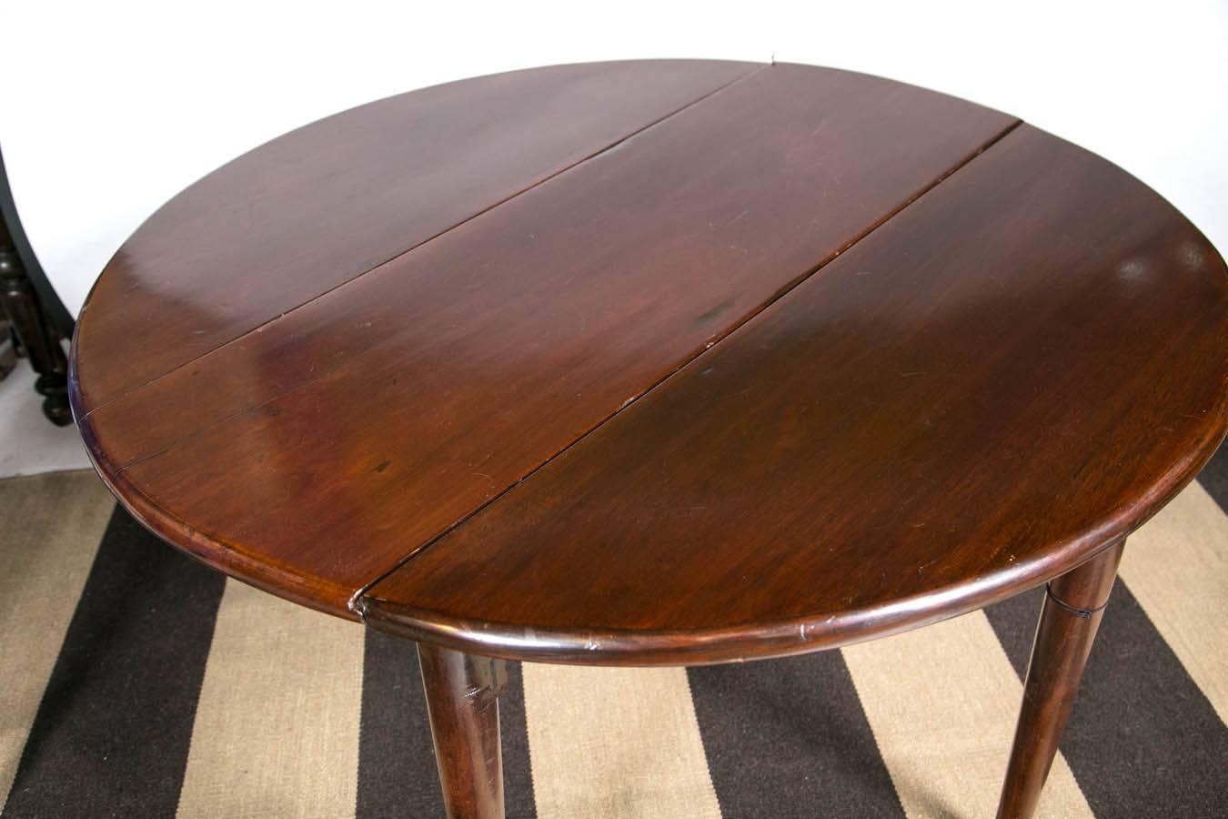 a fabulous English drop leaf table great color and shape look at those legs!