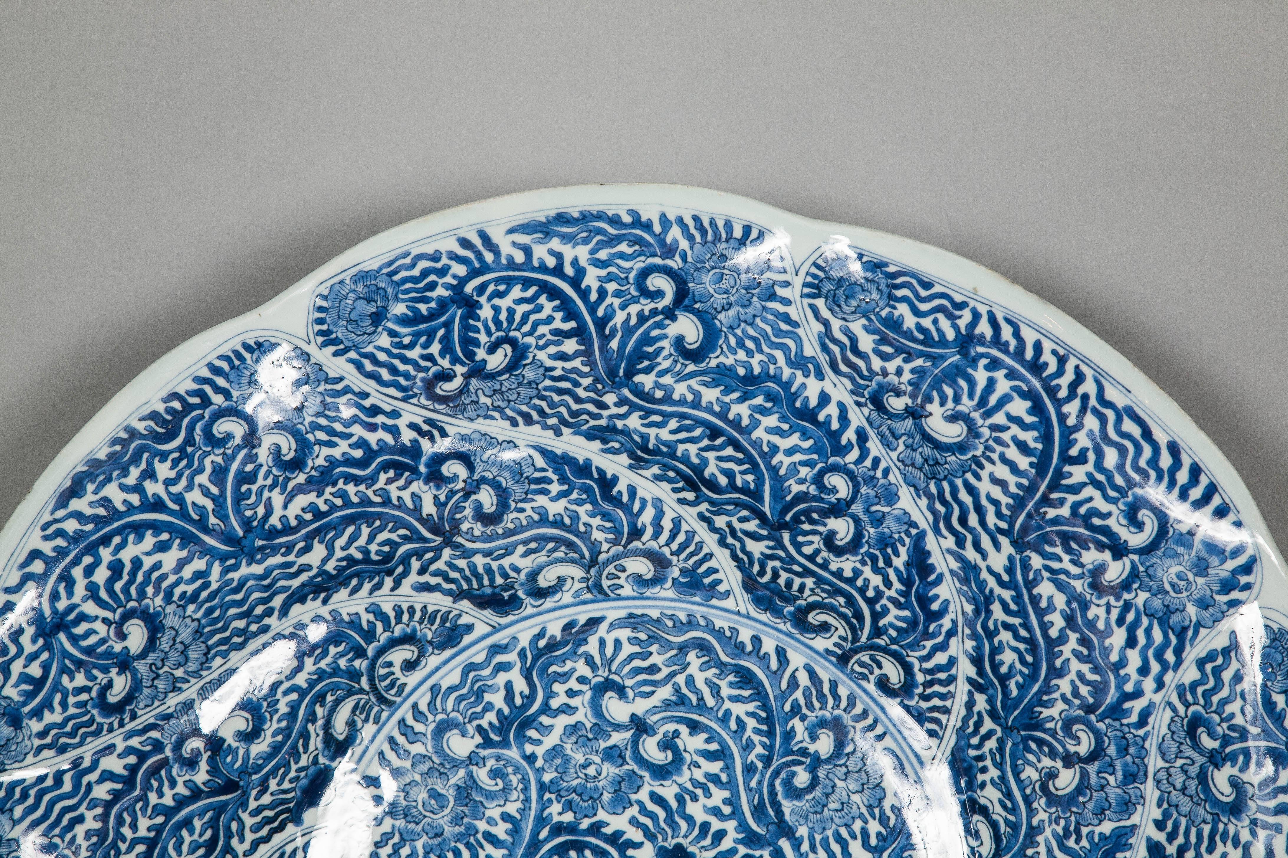 A rare, oversized, possibly unrecorded,pair of Chinese Kangxi Dynasty (1662-1722) Blue and White chargers dating from around 1700 and made for the foreign markets (export) most probably for the Dutch since the shape recalls one of 17th century