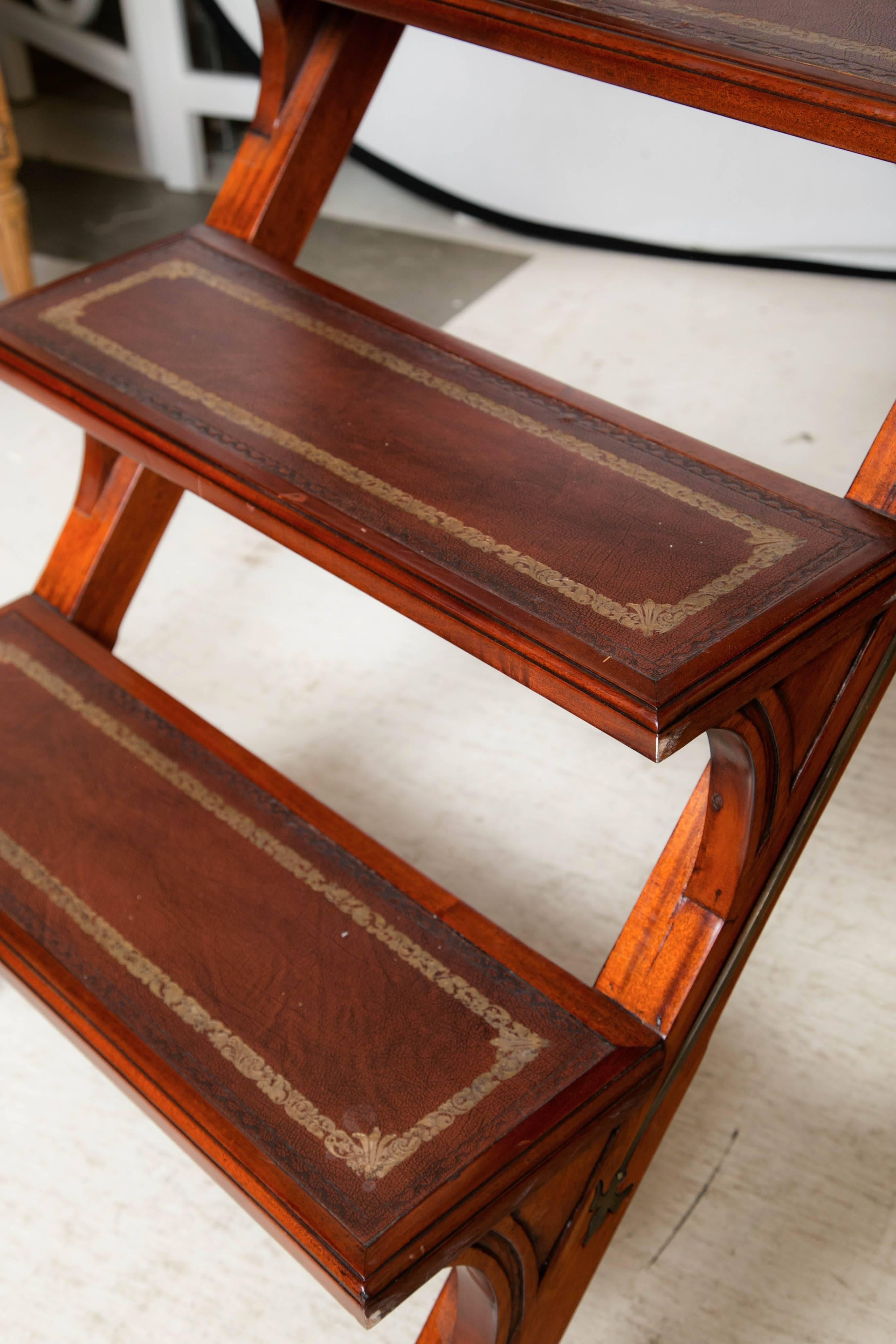 Library folding steps ladder in mahogany, leather with brass inlay.