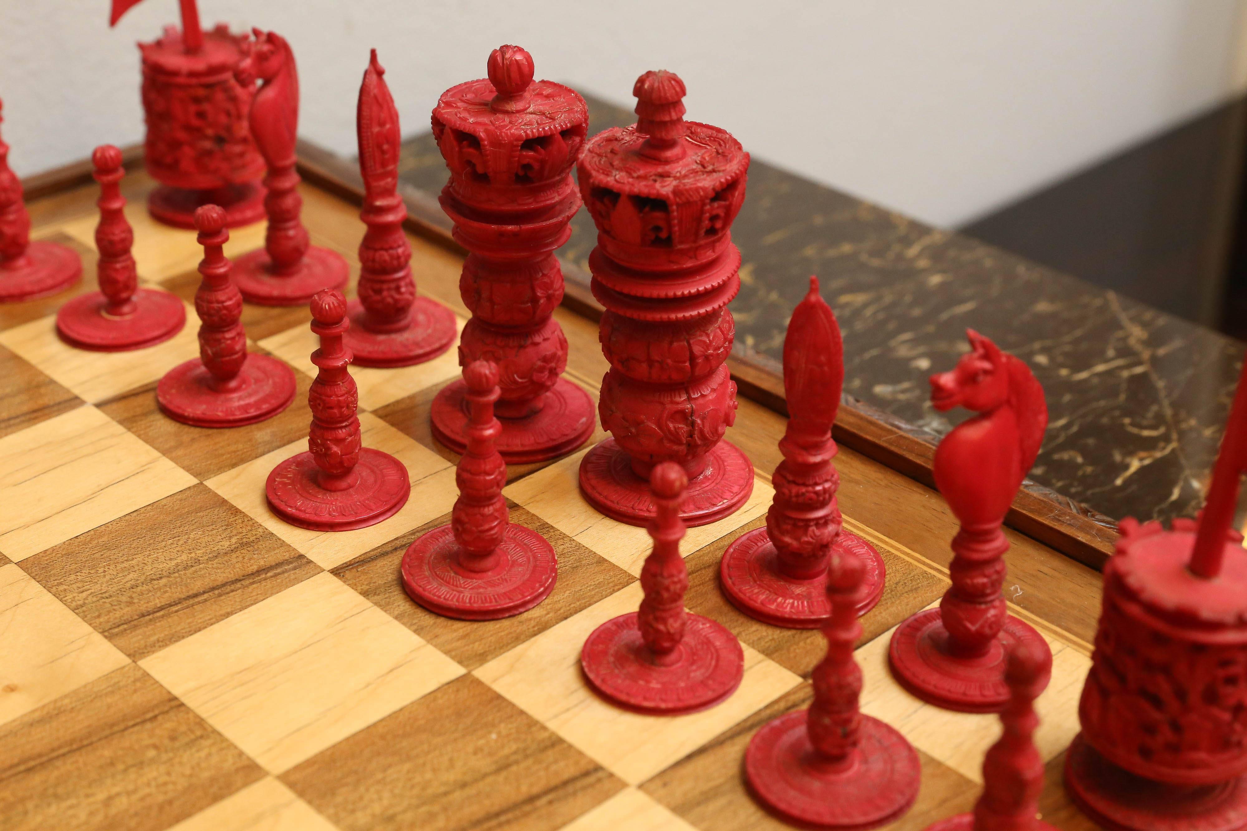 Indian bone pieces carved probably in Burma, and more than likely for Chinese carvers for an export. Natural bone and dyed red. The chess set is 19th century. Some repairs and age cracks. The king stands at 3 3/4 