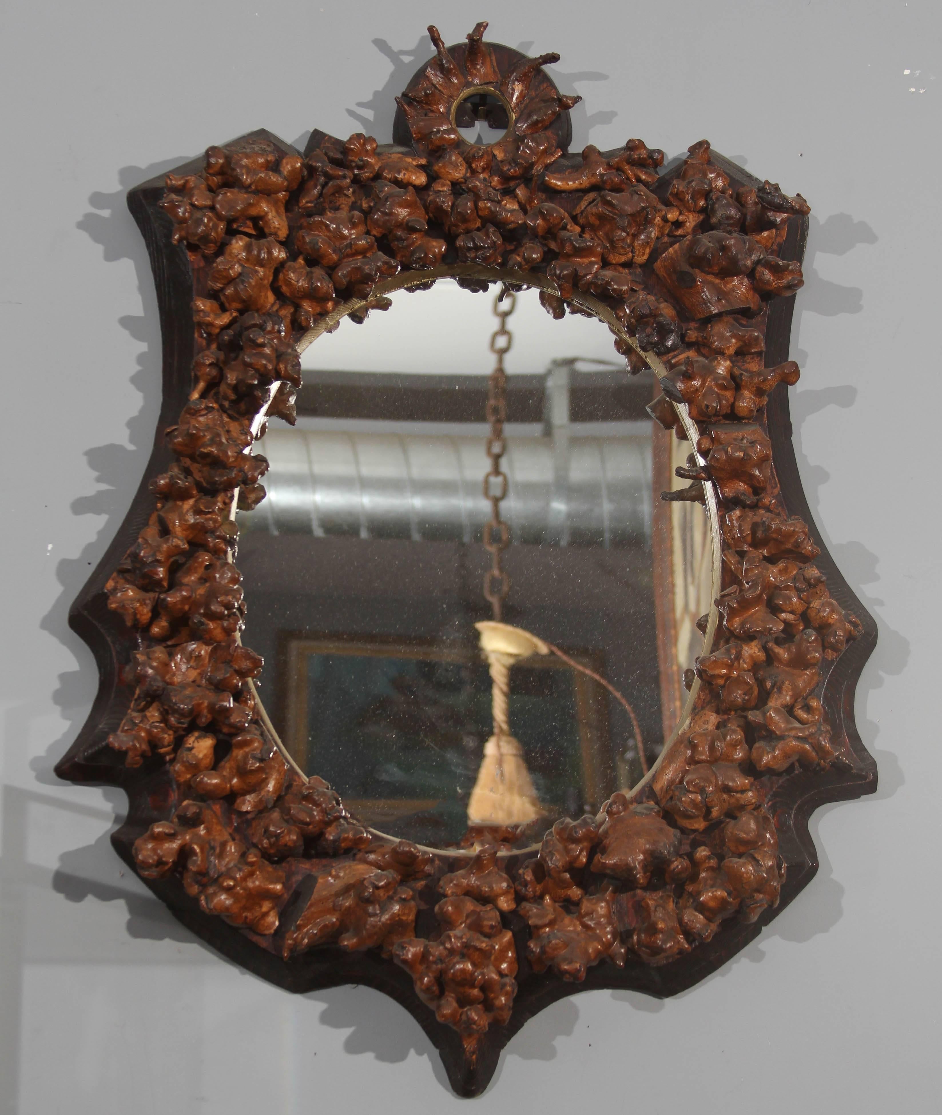 Early 19th century Folk Art mirror of gnarled grapevine knuckles from vineyard in France. Beautiful.