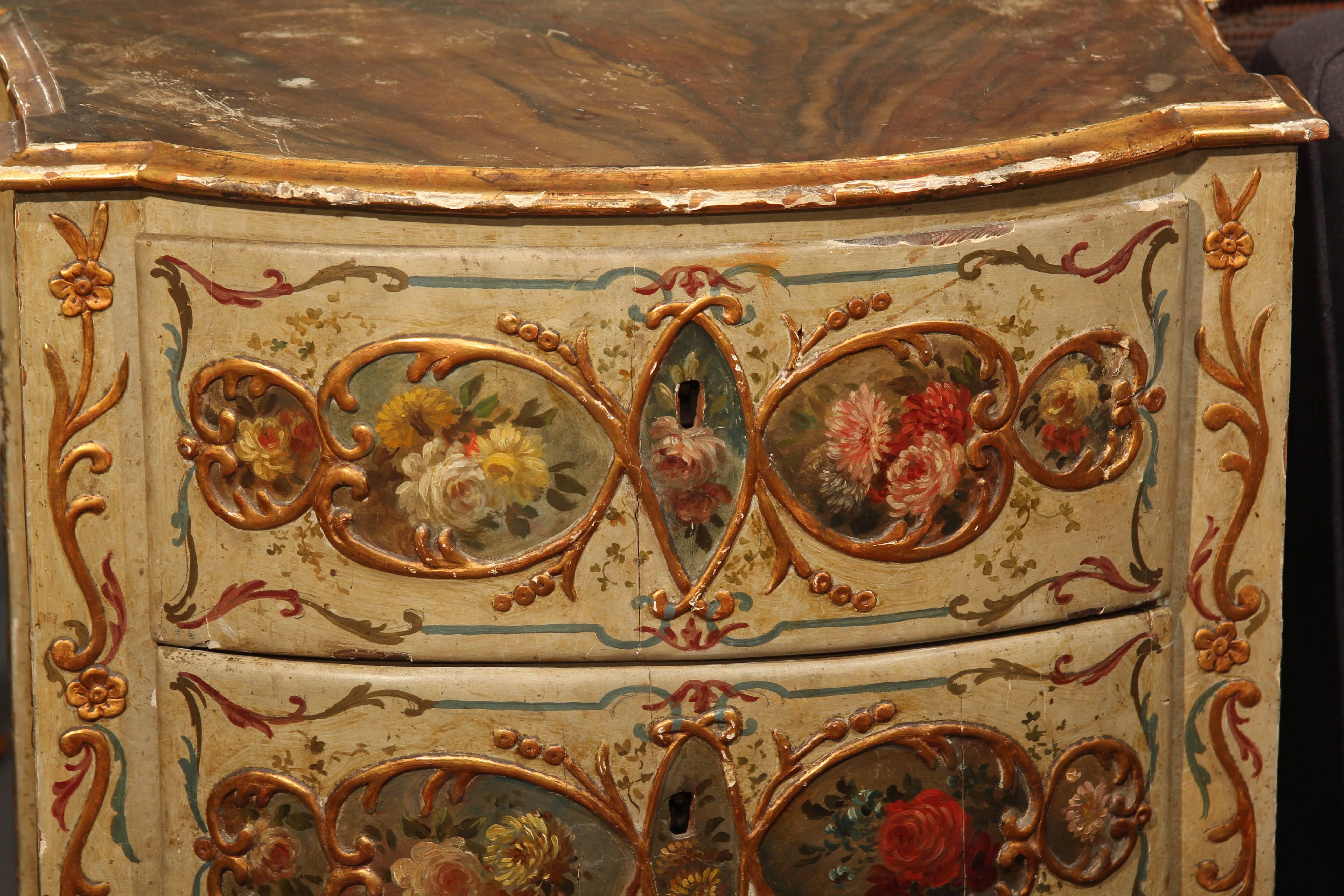 Charming hand-painted pair of small Italian chests, circa 1820. Painted wood faux marble tops, two drawers.