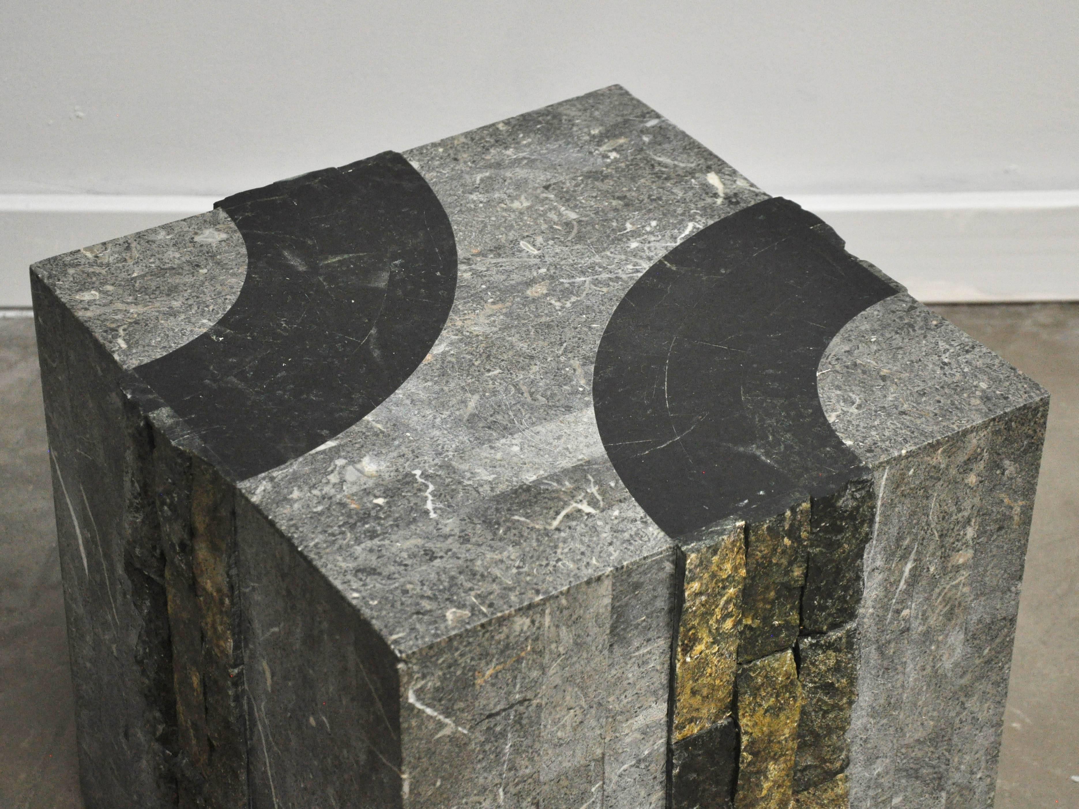 Side table in tessellated stone with graphic marble inlays, circa 1980s.