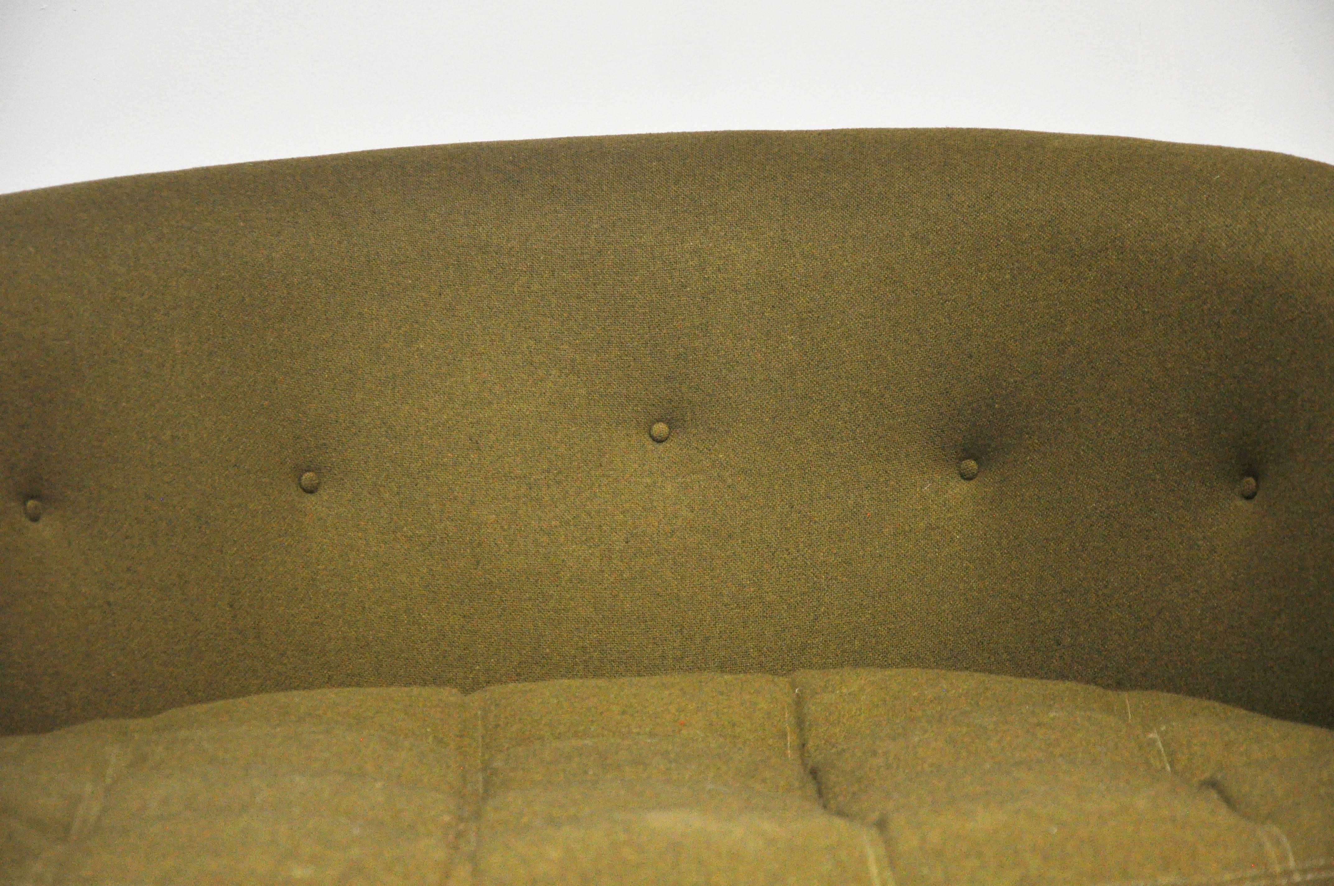 Oversize cuddle chair by Milo Baughman. Original upholstery over fully walnut base.
 