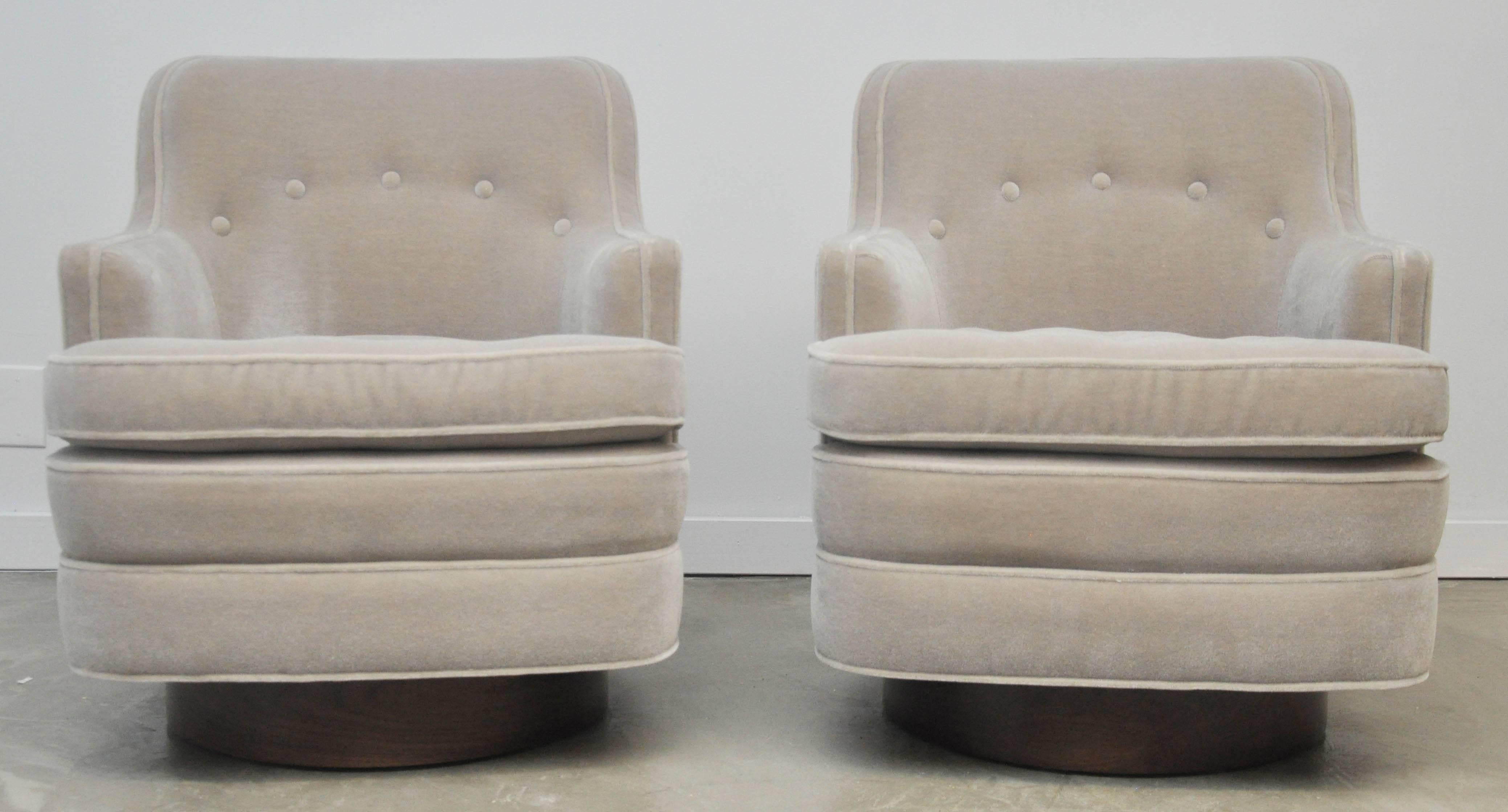 Swivel chairs by Edward Wormley for Dunbar. Fully restored. New mohair upholstery over new walnut swivel bases.