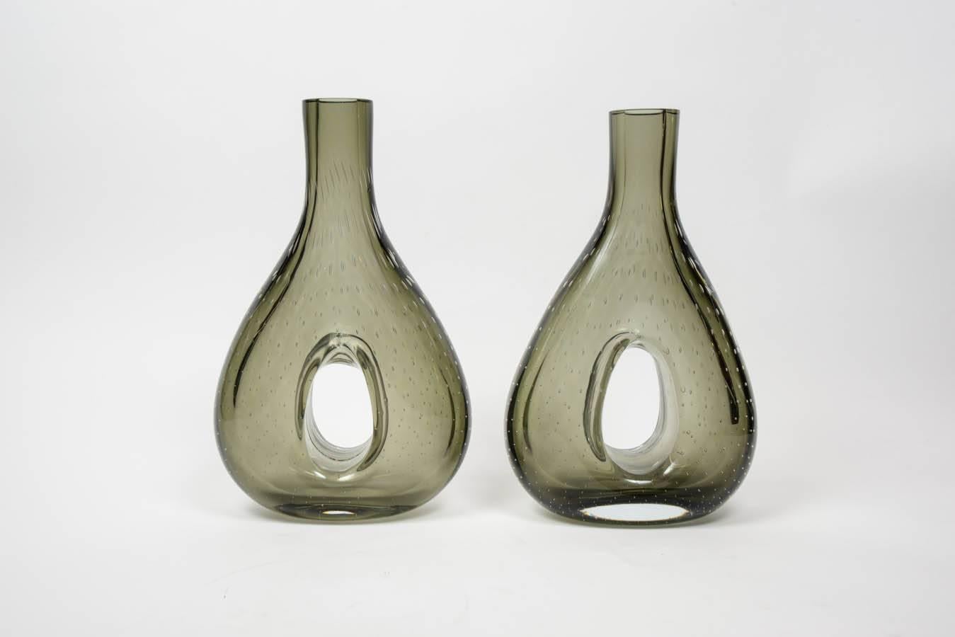 Pair of atypical shaped vases, made in smoked Murano glass. 

Interesting details are the air bubble inside the glass creating an all-over pattern.
