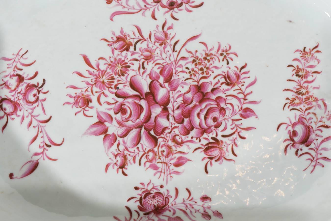  This beautiful pink 18th century Chinese platter is hand-painted with soft rose pink peonies on light gray-blue porcelain. The porcelain has the orange peel texture traditional to many 18th century Chinese porcelains. Along the edges the rose pink