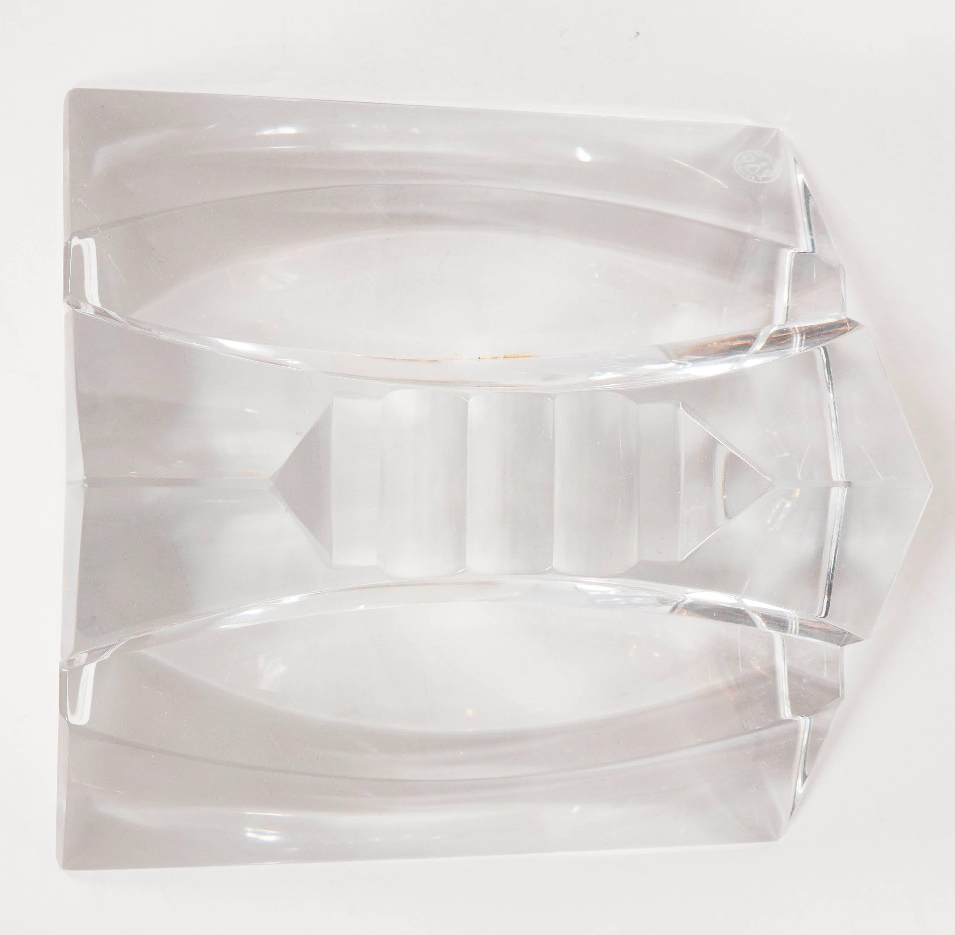 This stunning ashtray /cigar holder features a string geometric triangular form design with cut crystal and beveled detailing. This piece is not only functional but a great sculpture as well. It bears the Baccarat seal and mark on the bottom. It is