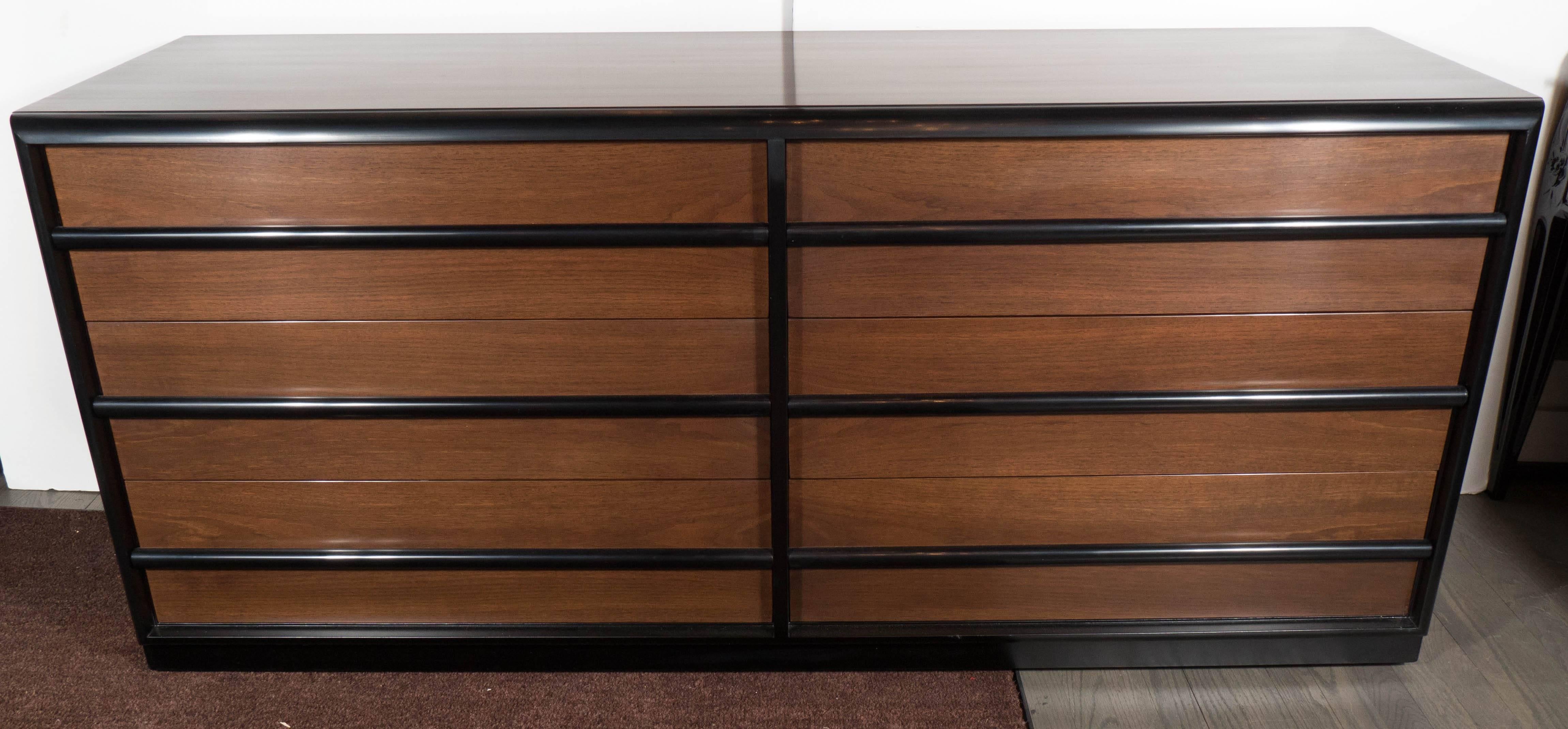 This sophisticated and large-scale Mid-Century Modern eight drawer high chest was realized by T. H. Robsjohn-Gibbings for Widdicomb Company, circa 1950. Robsjohn-Gibbings represents one of the premiere British tastemakers of the 20th century. Along