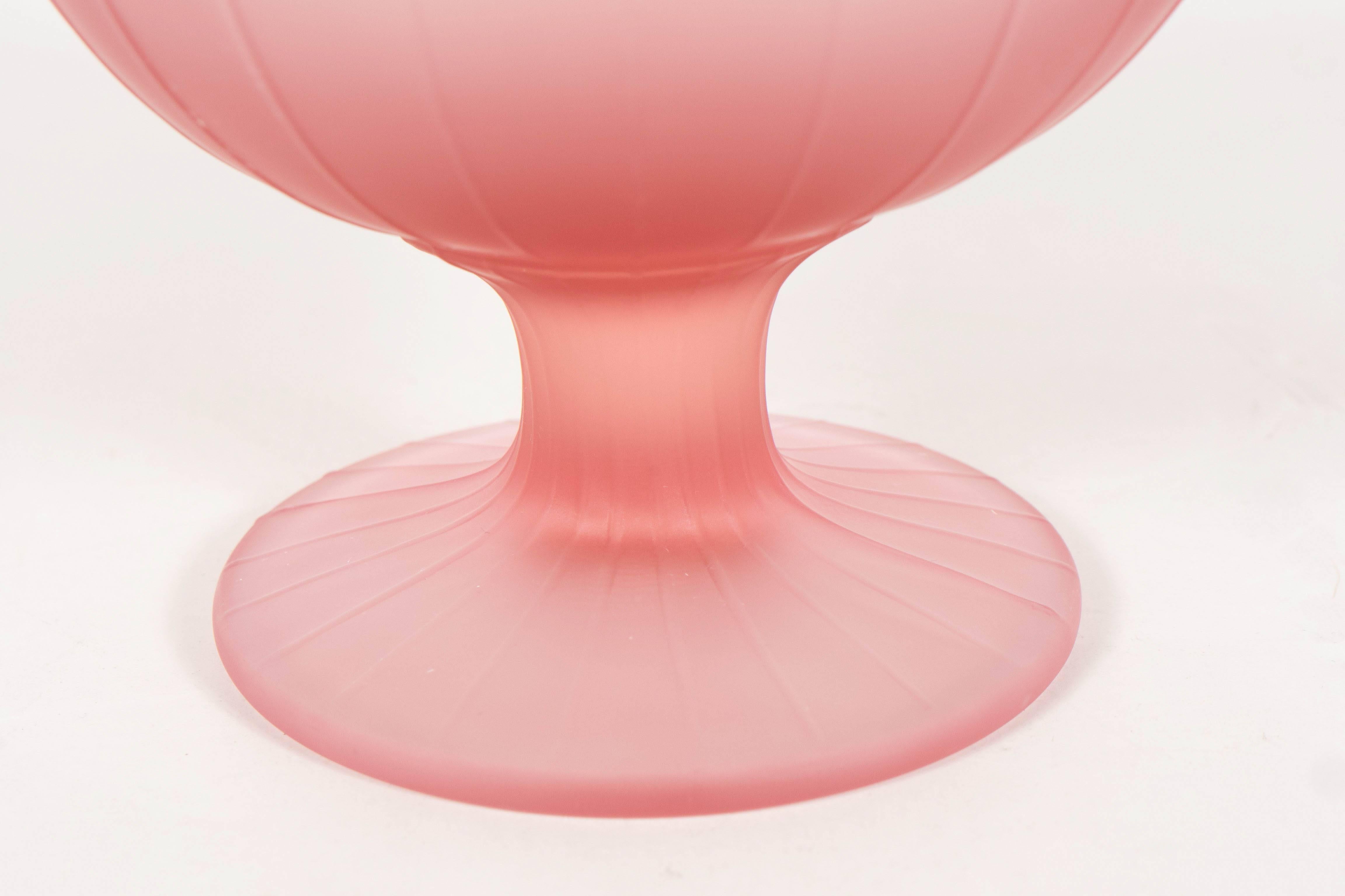 These gorgeous set of six bowl by carole Stuppell are made of frosted raspberry colored glass and feature ribbed lineal detailing.An exquisite addition to any table.