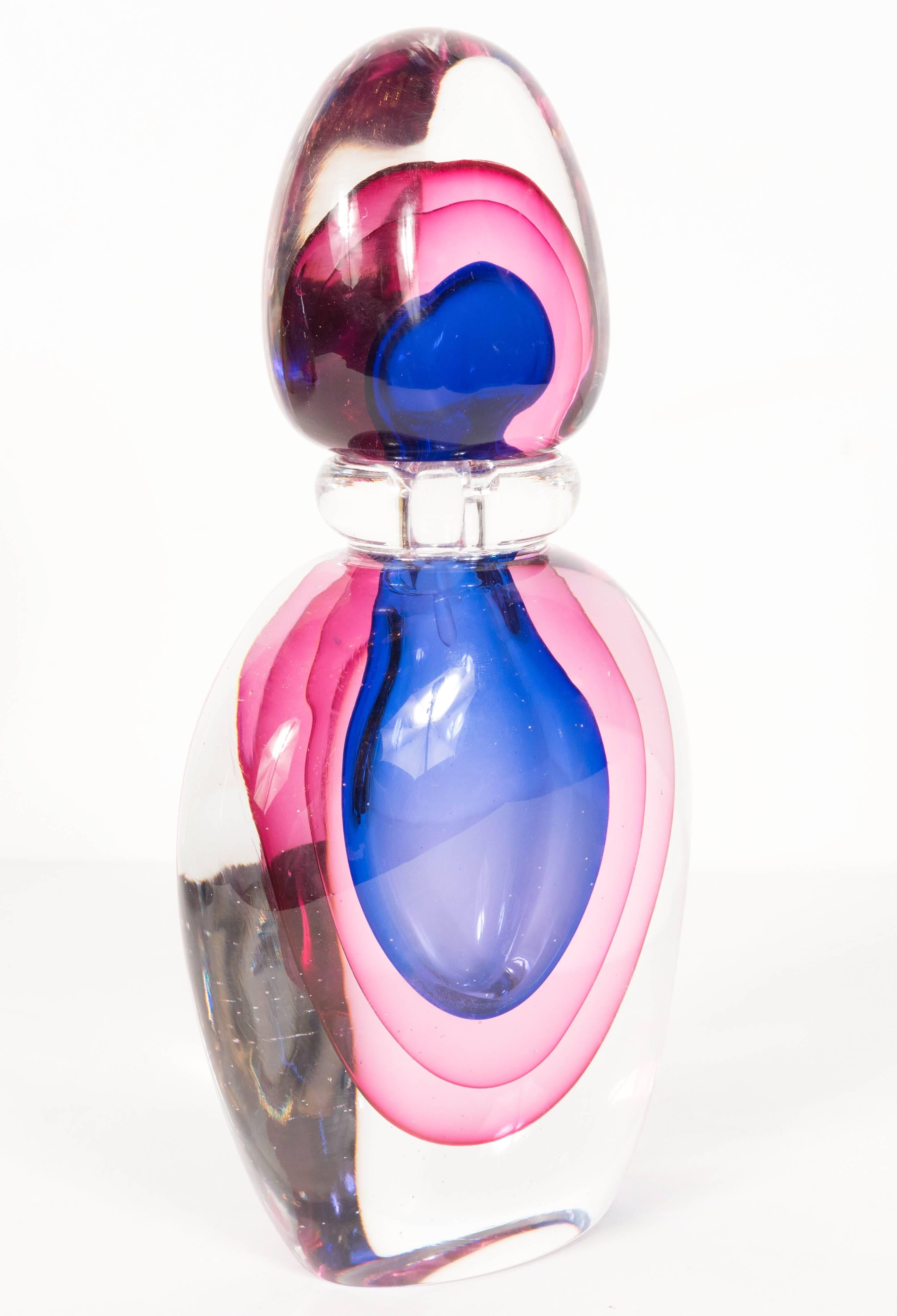 blue and pink perfume bottle