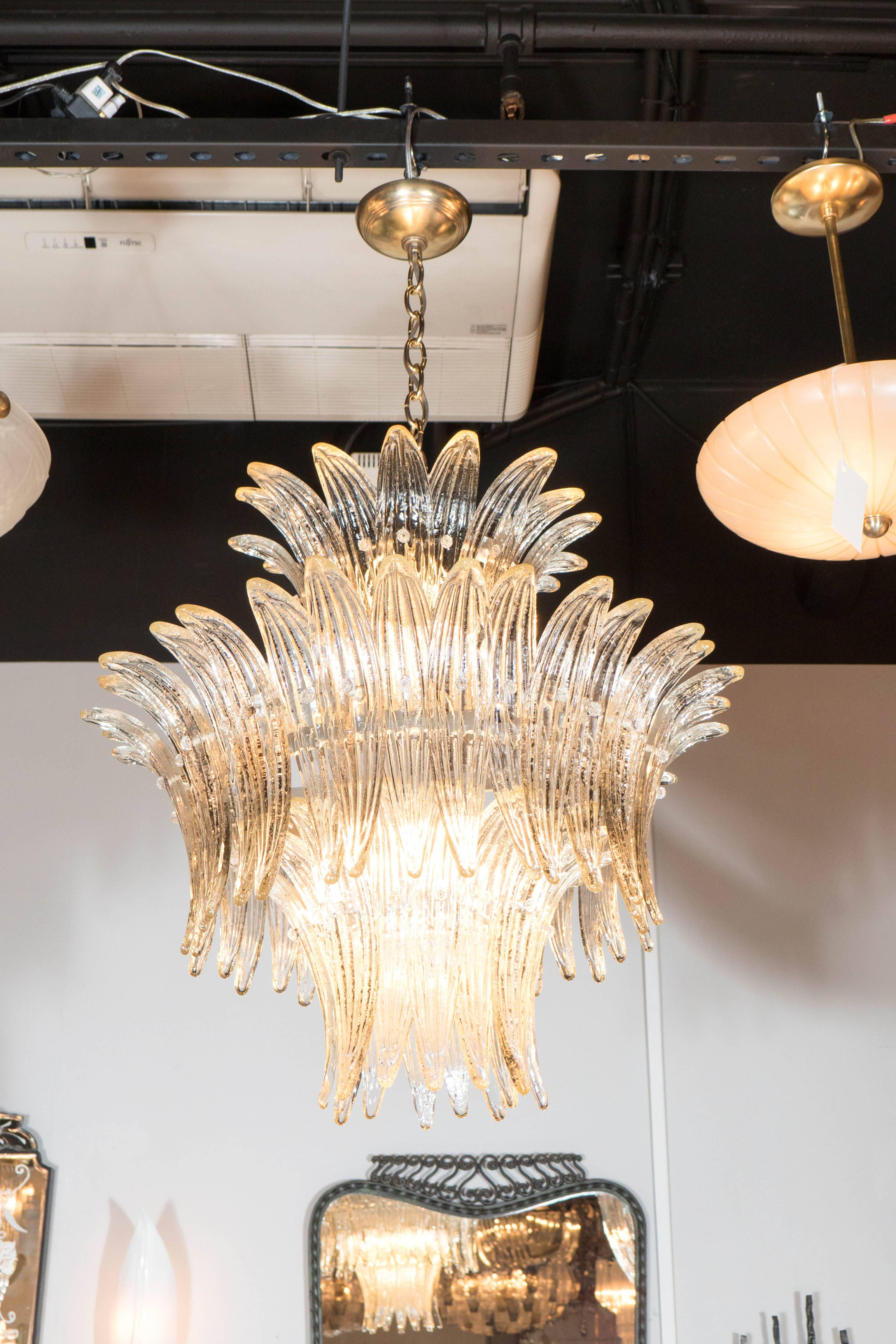 A truly exquisite three-tier Palma chandelier in smoked Murano glass with brass fittings. Individually attached 