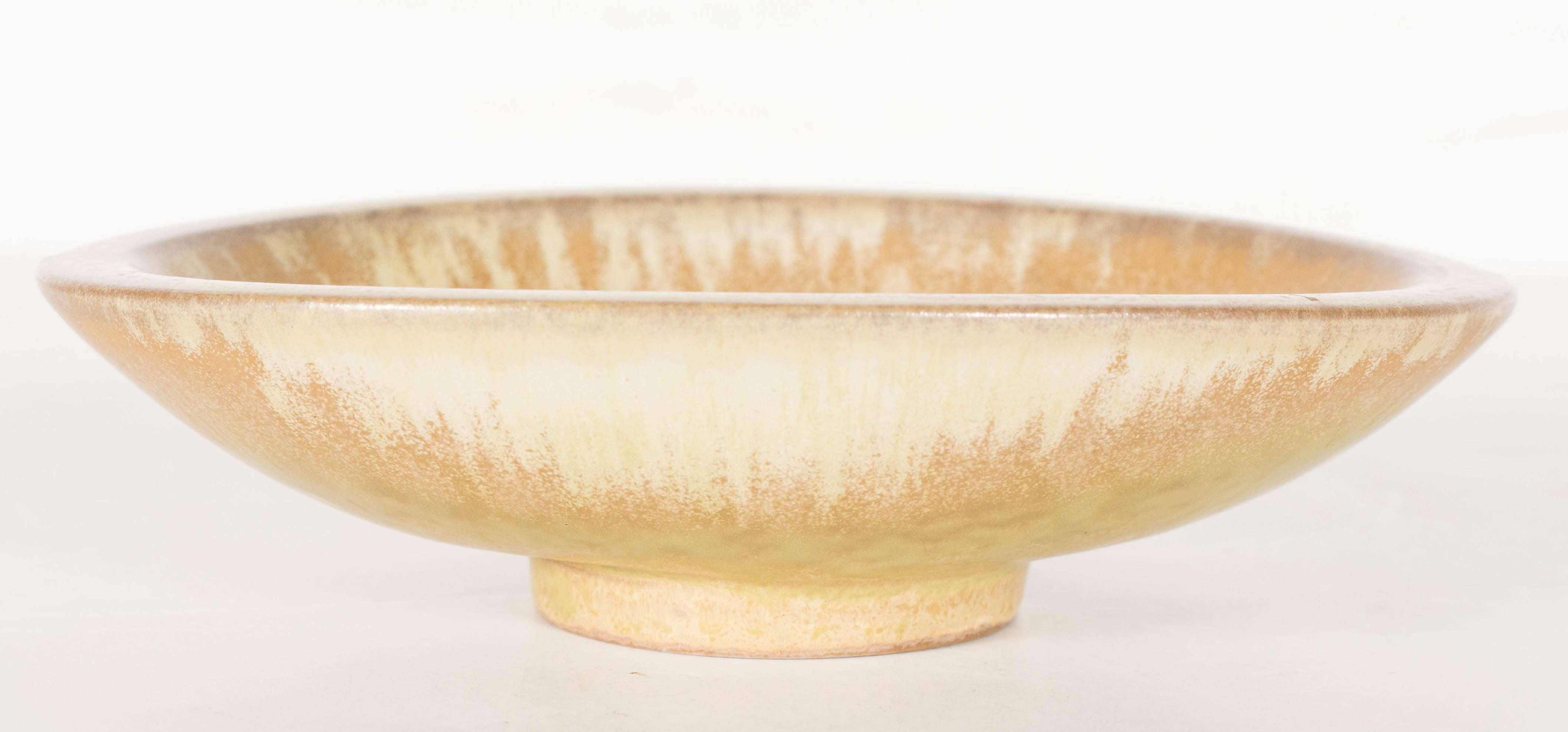 Handsome ceramic bowl by Gunnar Nylund for Rörstrand. Lovely hues of moss and cream adorn this piece. Perfect as a small catch-all, soap dish or simply as an object. This piece is signed and in excellent condition.