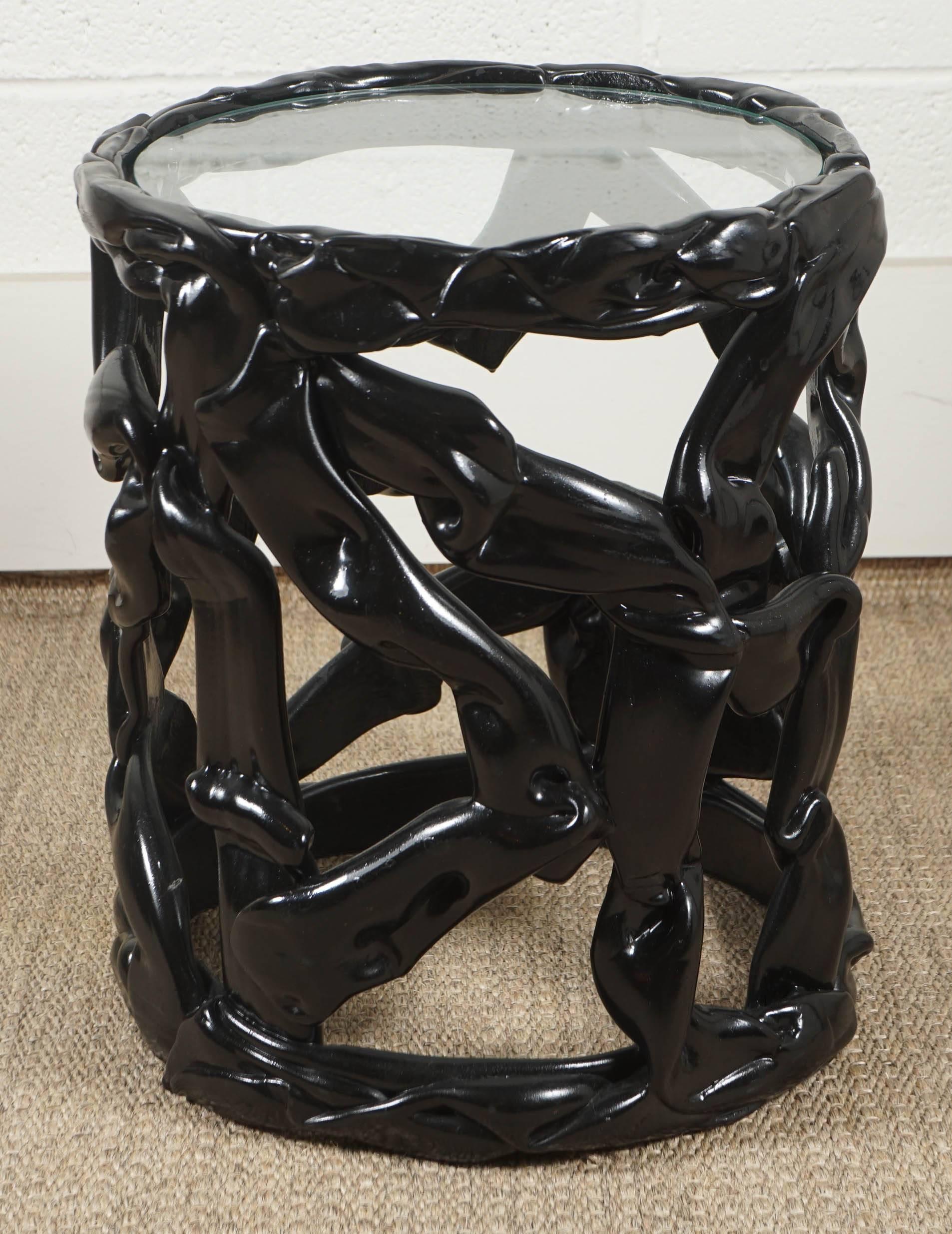 Here is a great Lucite ribbon table in a black lacquered finish with a glass top.