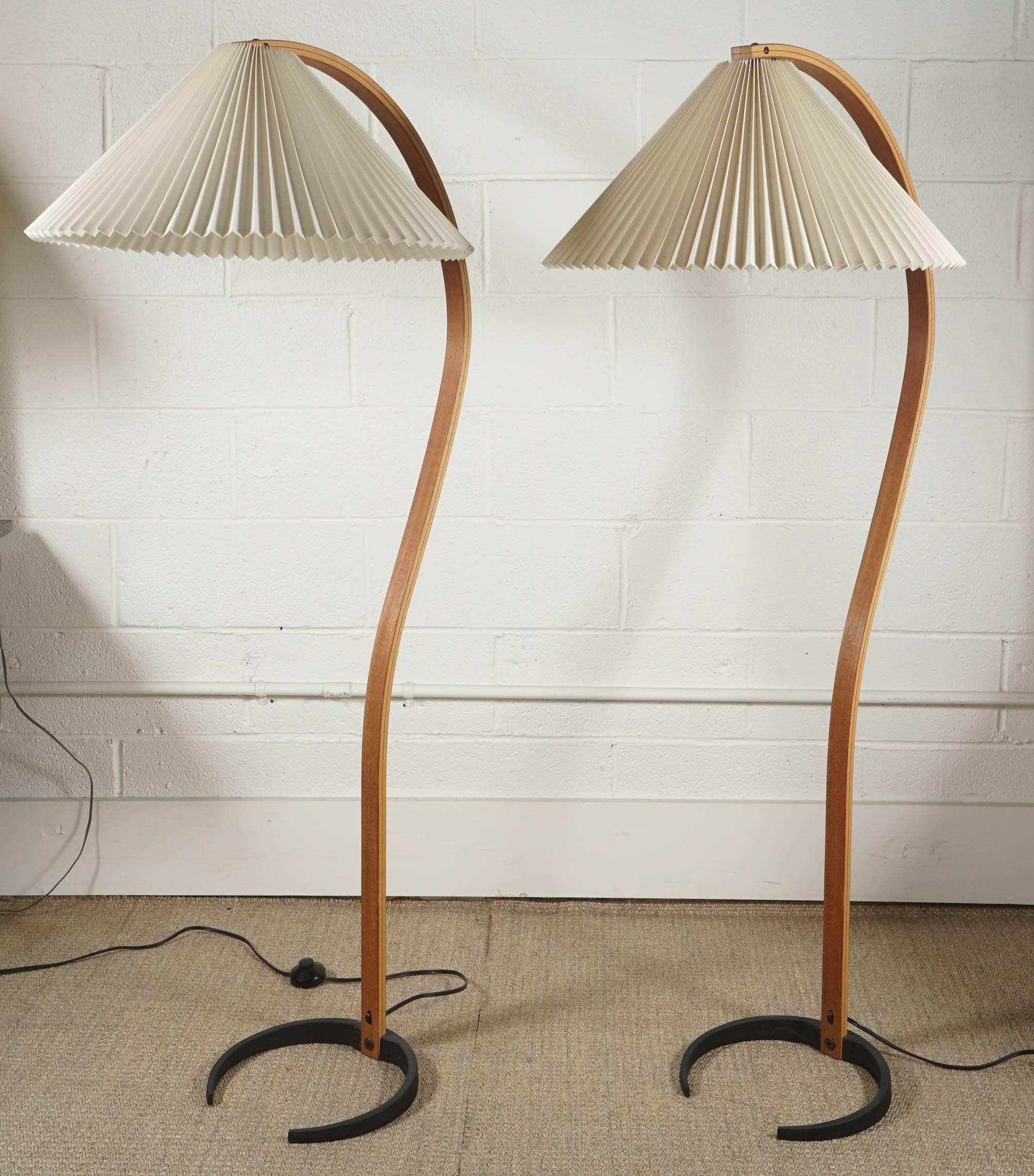 Here is a pair of Caprani standing lamps with a bentwood base. The pleated shades are original and in very clean condition. The base is iron with the mark Caprani. Available as a pair or as singles for $1,800. Each.