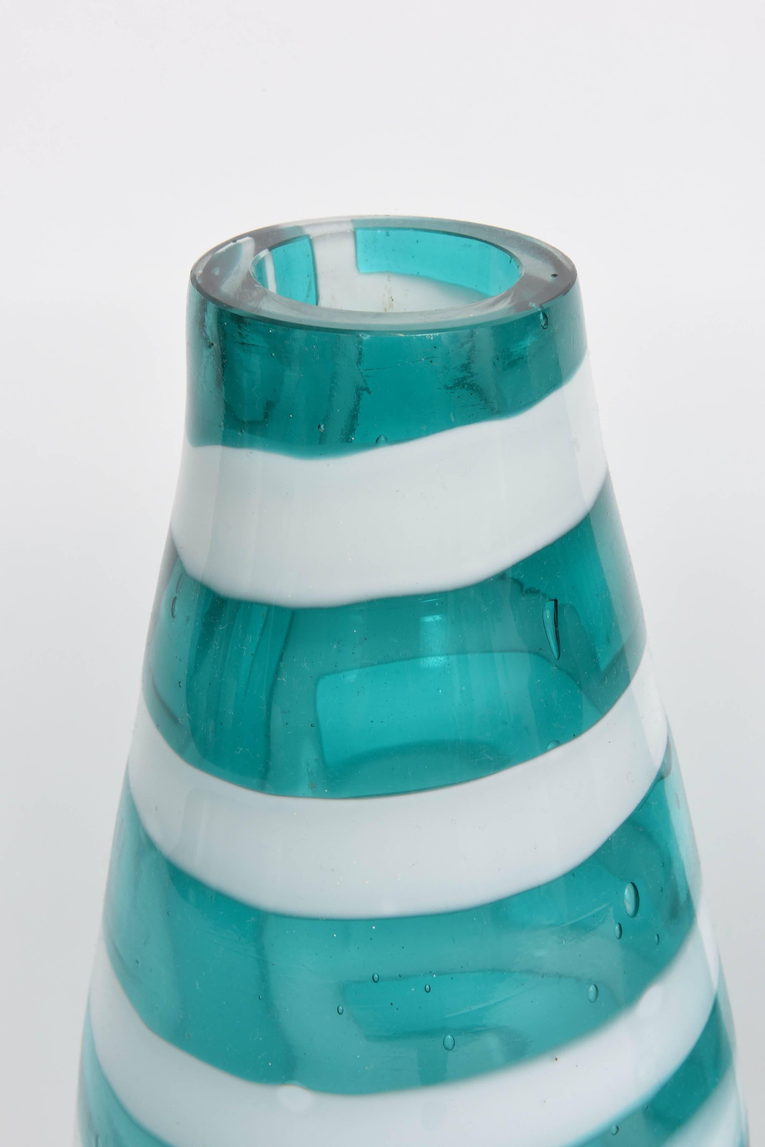 This dazzling pair of Murano vases have been drilled for easy conversion to lamps.  Aqua and milk white stripes.   Attributed to Fulvio Bianconi for Cenedese.  Unsigned.