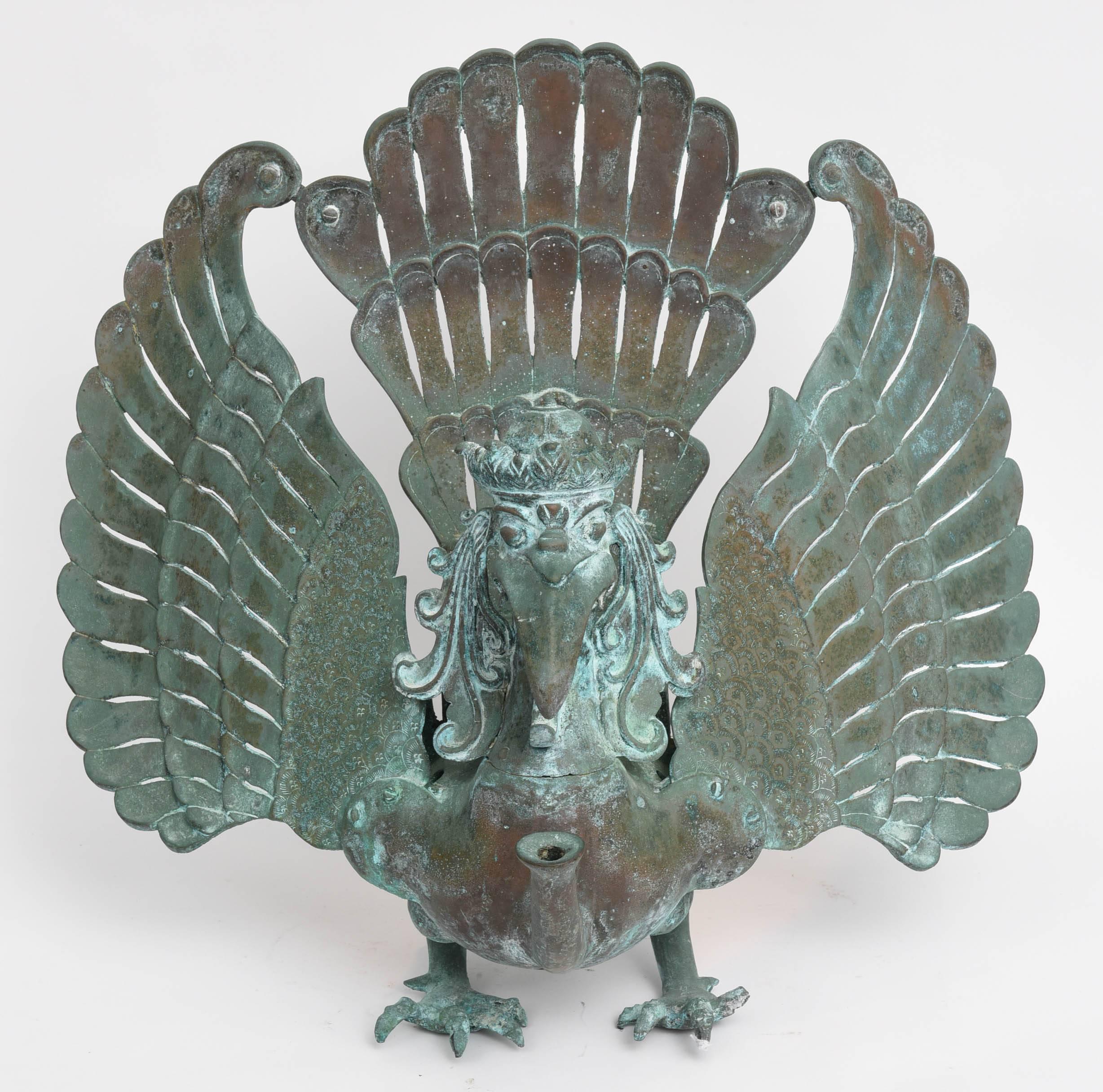Garuda is a mythological human-like bird on which the Lord Vishnu rode in both Hindu and Buddhist culture.  It is a simple of ferocity and intelligence.

Reference is made to a similar Garuda sculpture in the Brooklyn Museum.