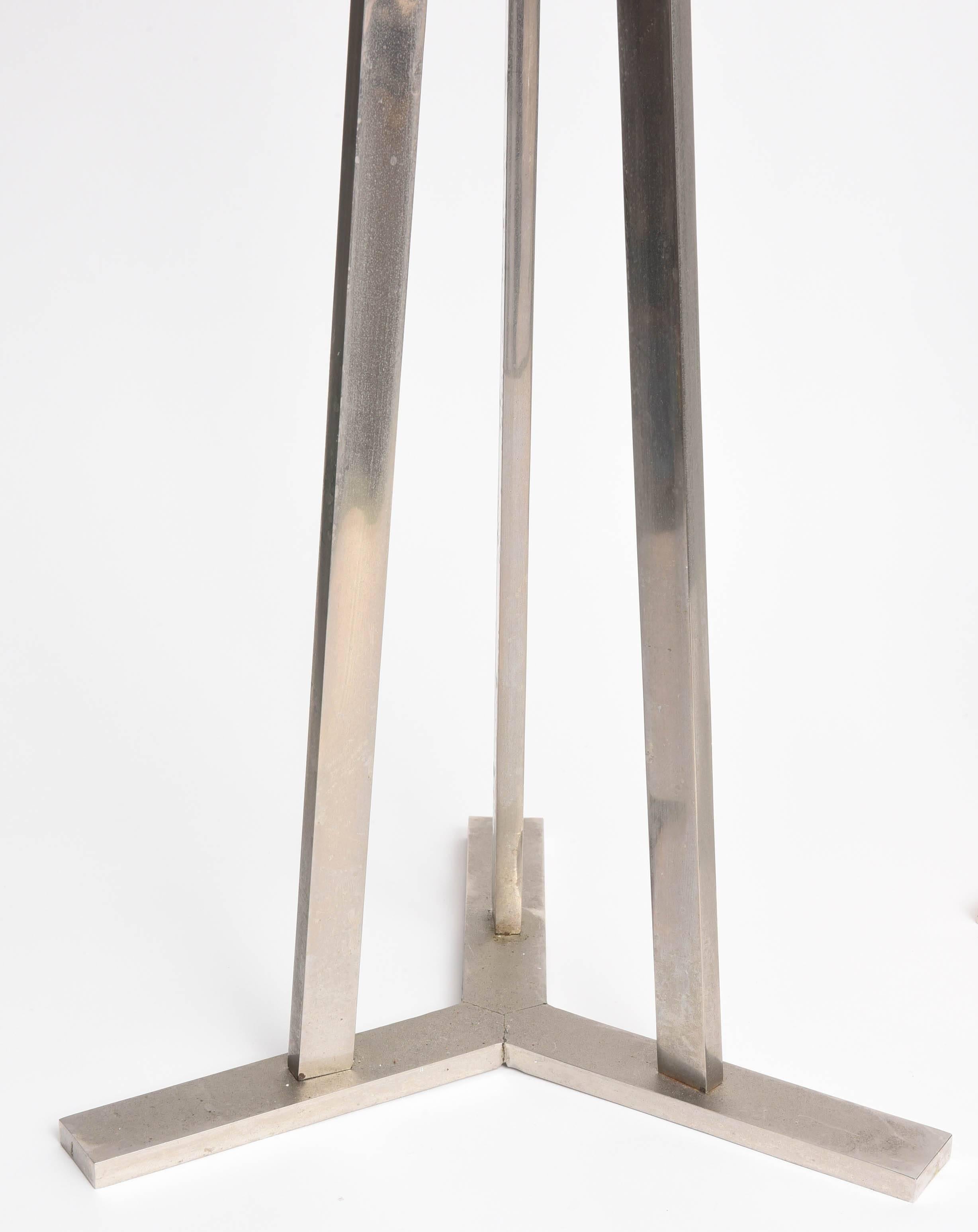 Very large chrome tripod candle stands from the 1970s.  Maybe be used on the floor or tabletop.