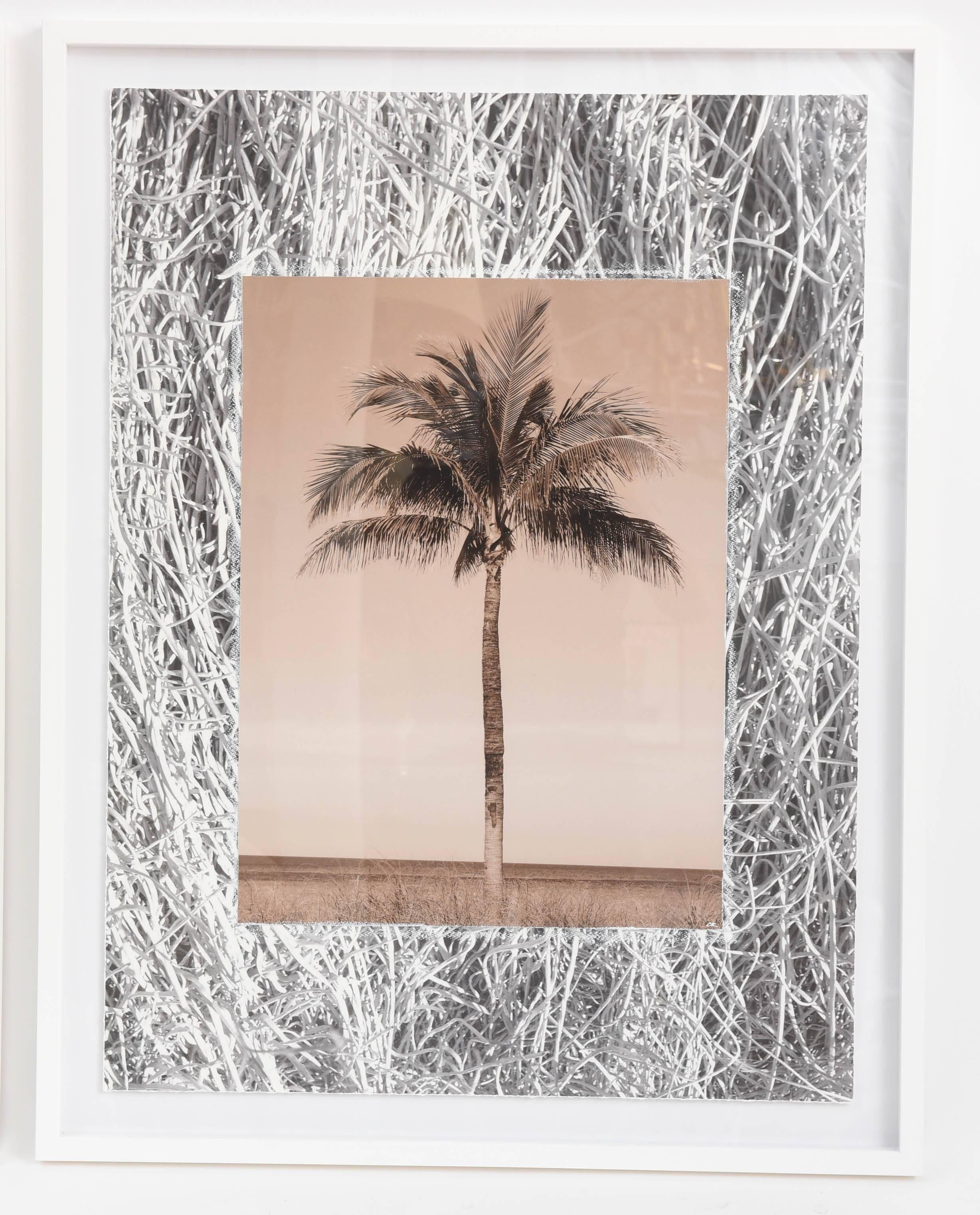 Pair of original tropical photo collages by artist Christine Ralphs, commissioned exclusively for Stripe. Sepia-toned palm photos are mounted over black and white textured backgrounds. All printed on watercolor paper and floating in simple gessoed