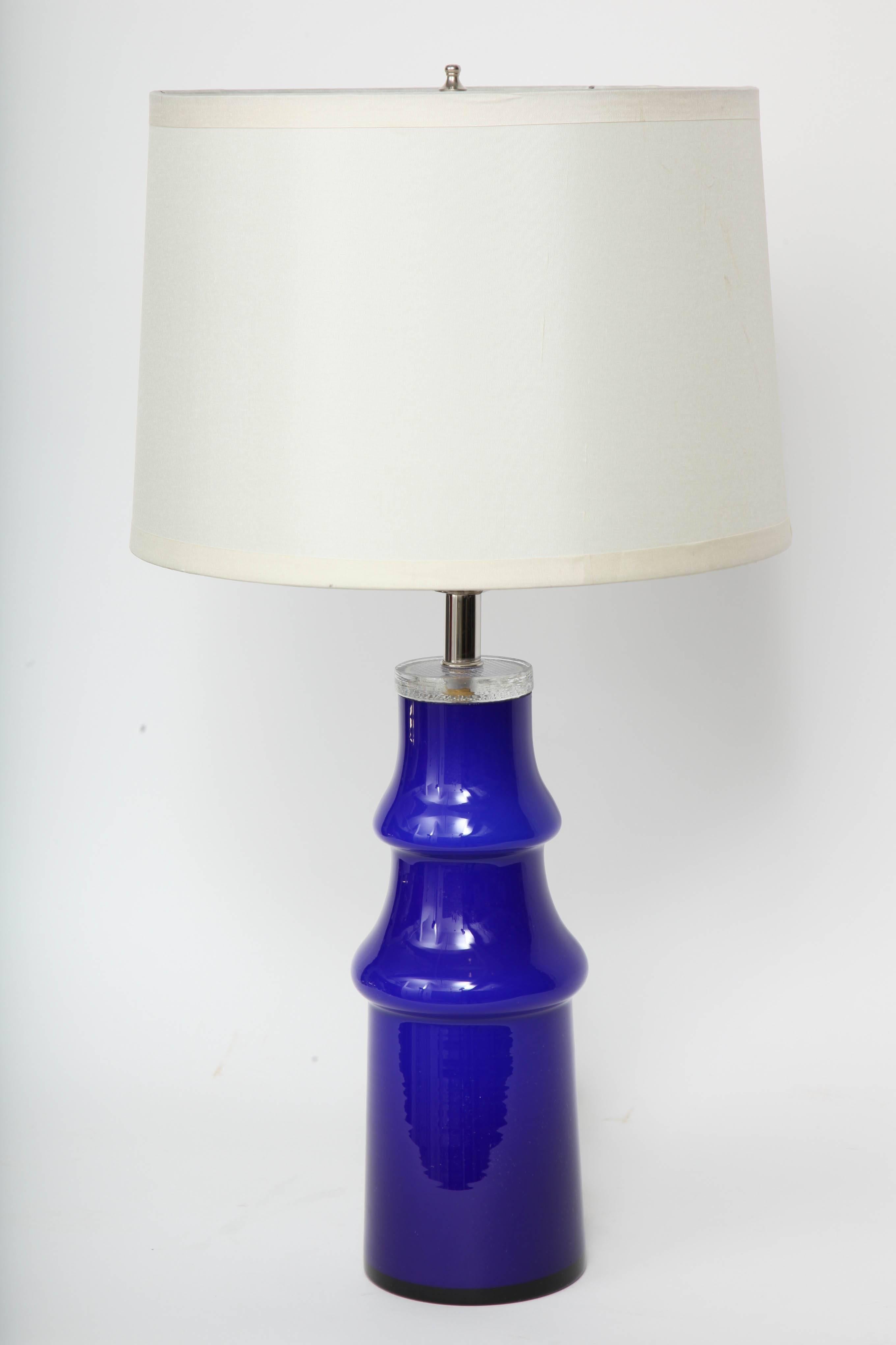 Swedish modern art glass lamp in a deep blue. Lamp has been rewired for the USA with nickel fittings and clear cord. 100W max bulb.