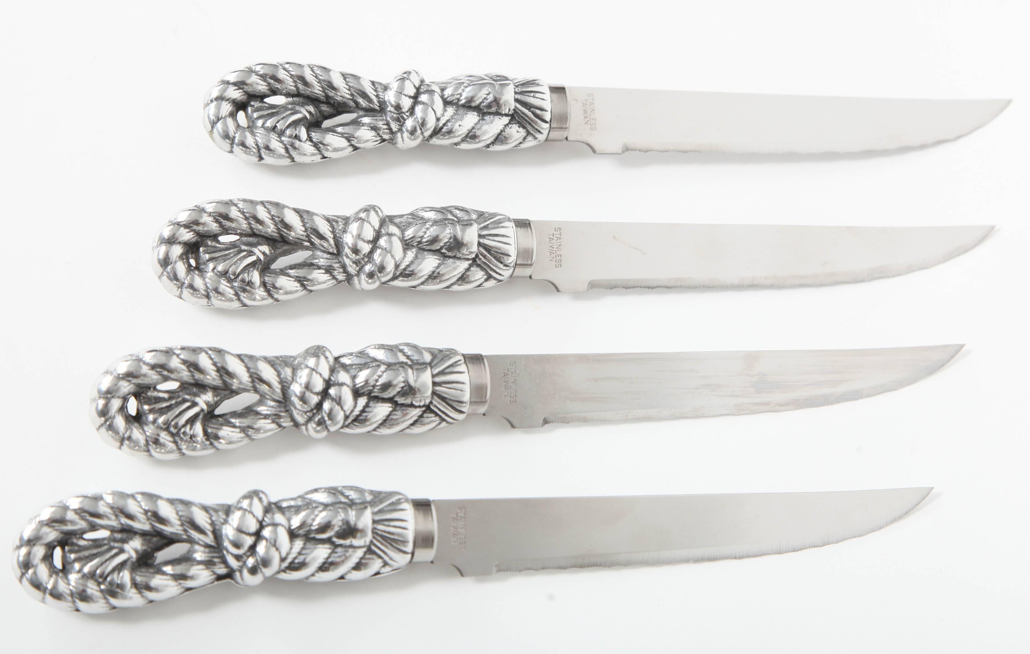 Steak knife set with heavy aluminum stylized braided tassel handles and serrated stainless blades. Like new condition....no wear on blades.