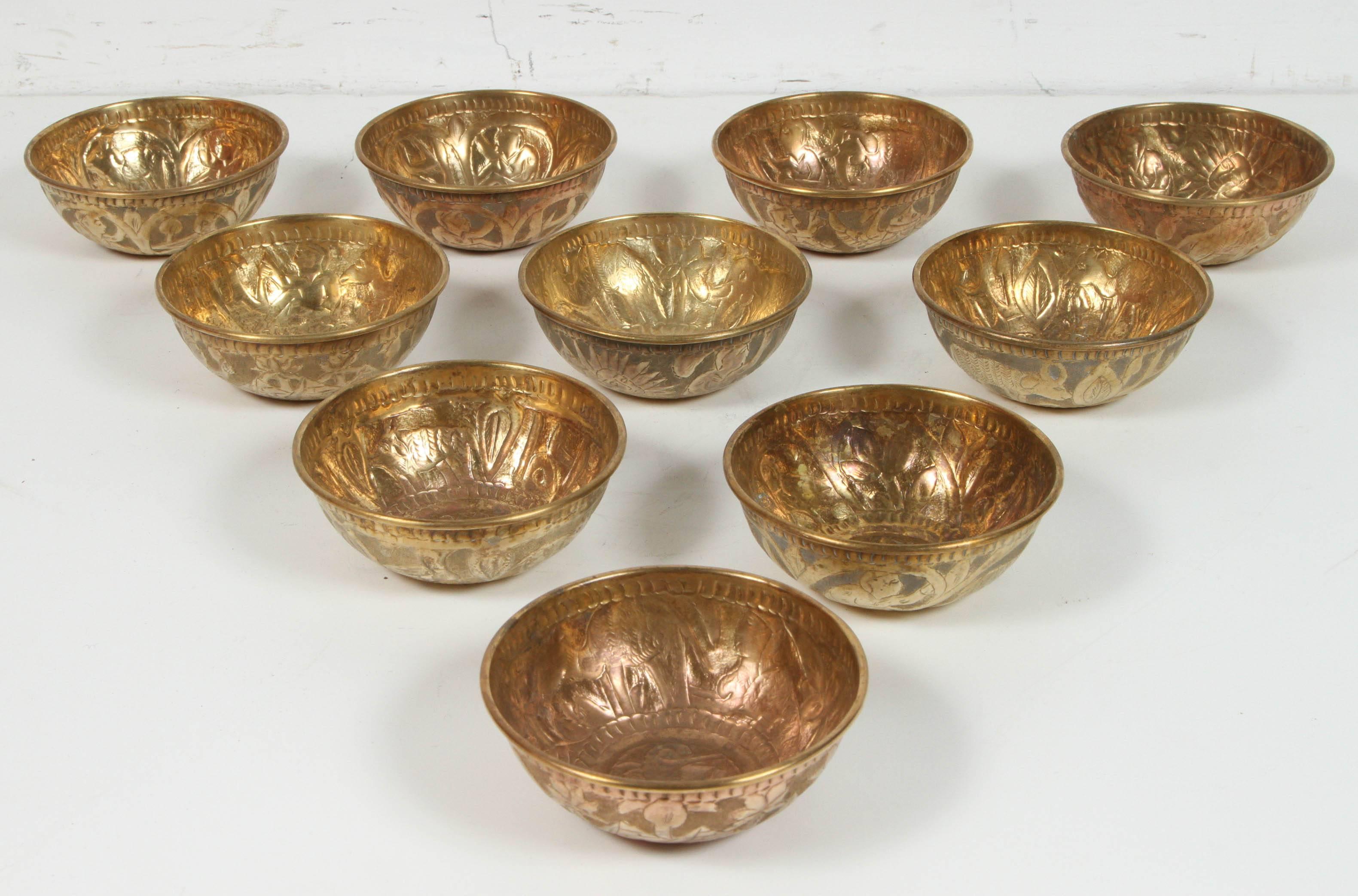 Set of ten antique Middle Eastern brass magic bowls.
Nicely handcrafted and hand-hammered with Moorish floral designs and animal figures.
Each one is one of a kind with a unique hammered and repousse design.
Very nice patina for this set of