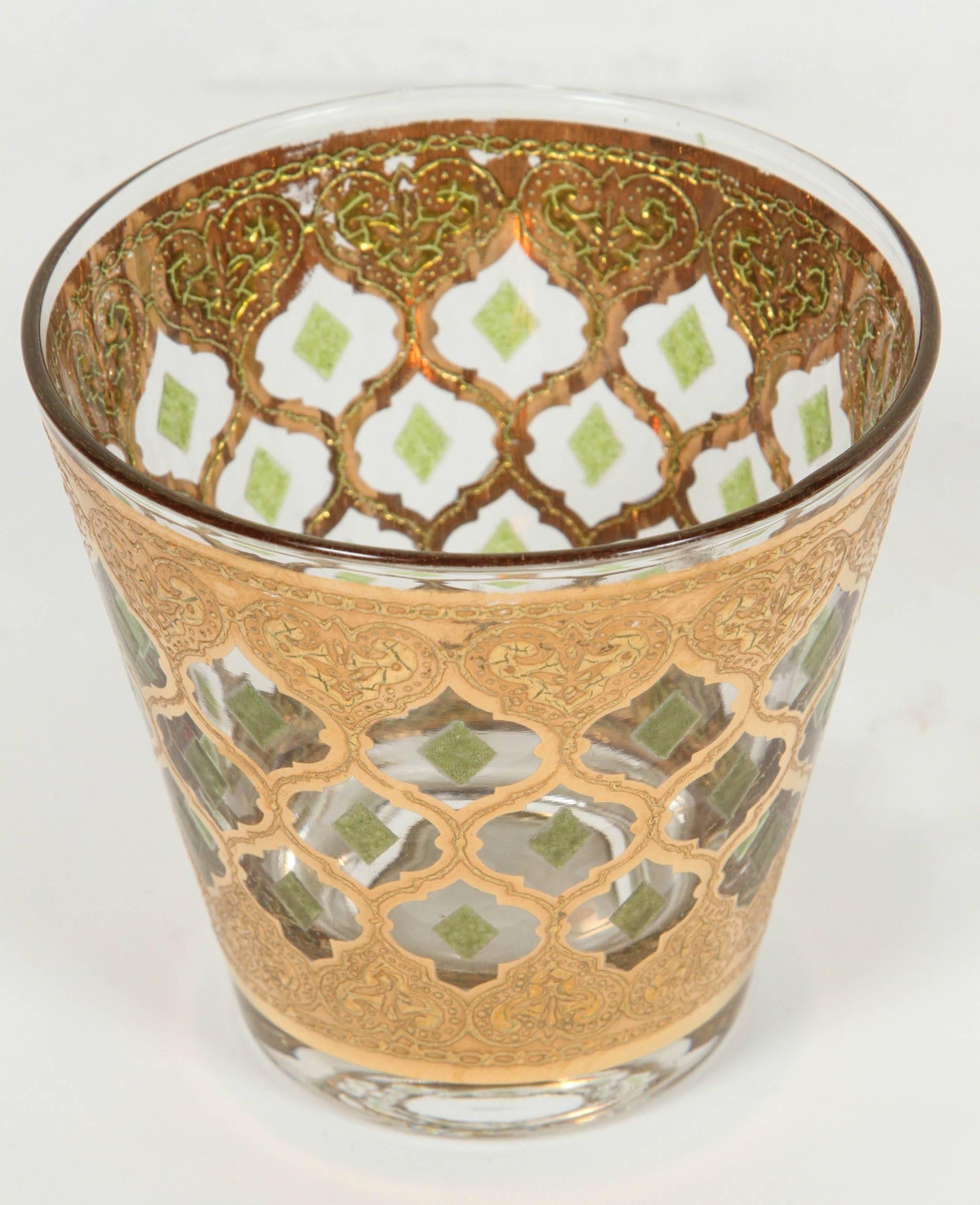 8 Mid-Century Vintage lowball rocks glasses from Culver with 22 Karat Gold in Valencia Moorish designs. 
Very elegant vintage barware glasses with a gold leaf finish.
 Size: 3.5