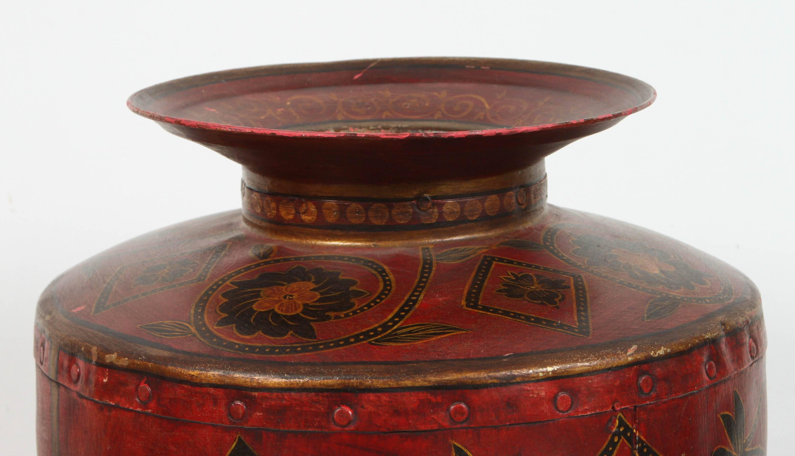 Hand-painted with flowering foliates on red background.
Indo-Raj large metal vessel, originally used to collect waters of the three sacred rivers, the Ganges and Yamuna Sarasvati, this large vessel is much more than just a piece of furniture. It