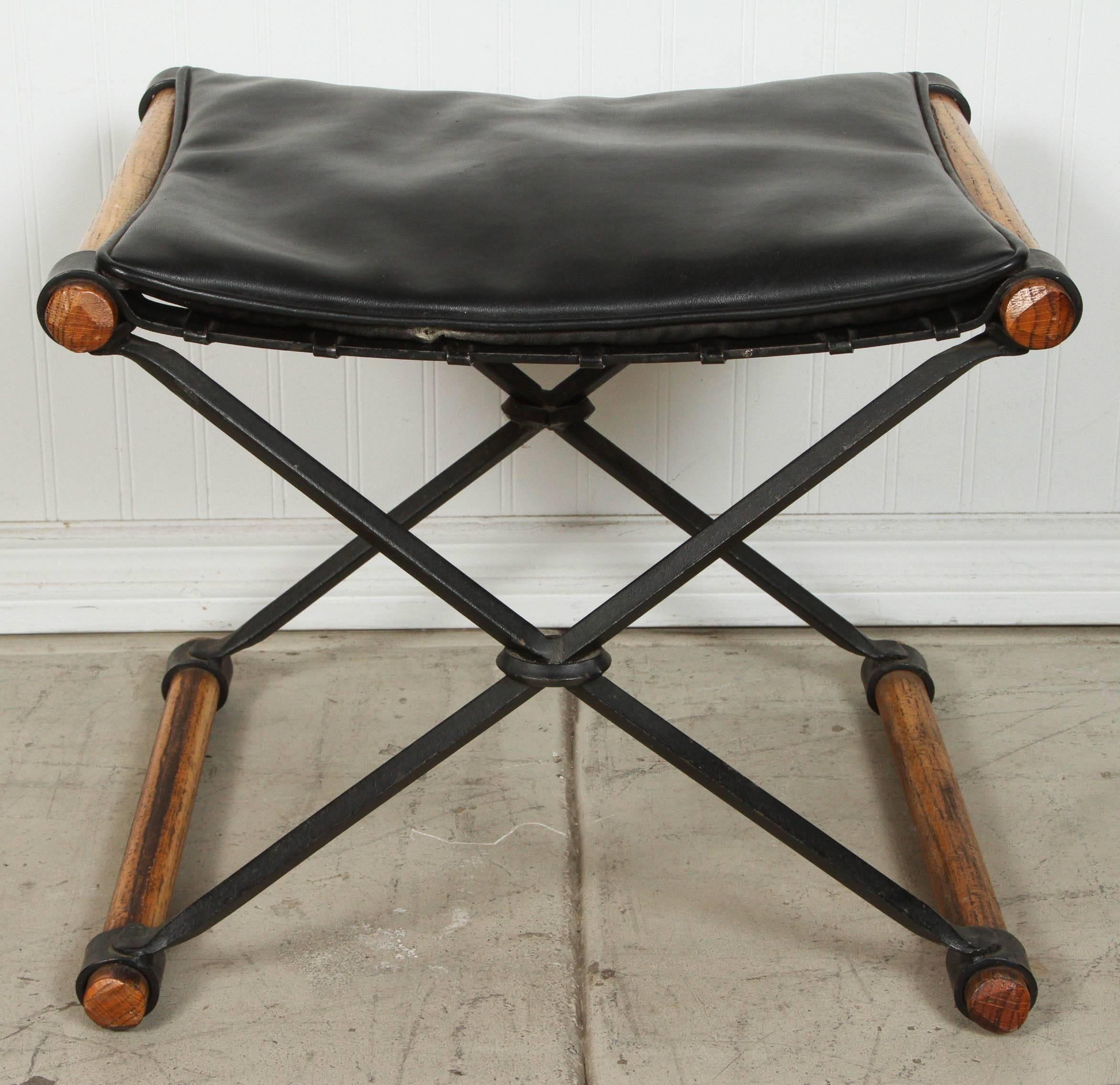 A nice pair of Cleo Boldson stools for Terra with black leather cushion which is the original upholstery. 