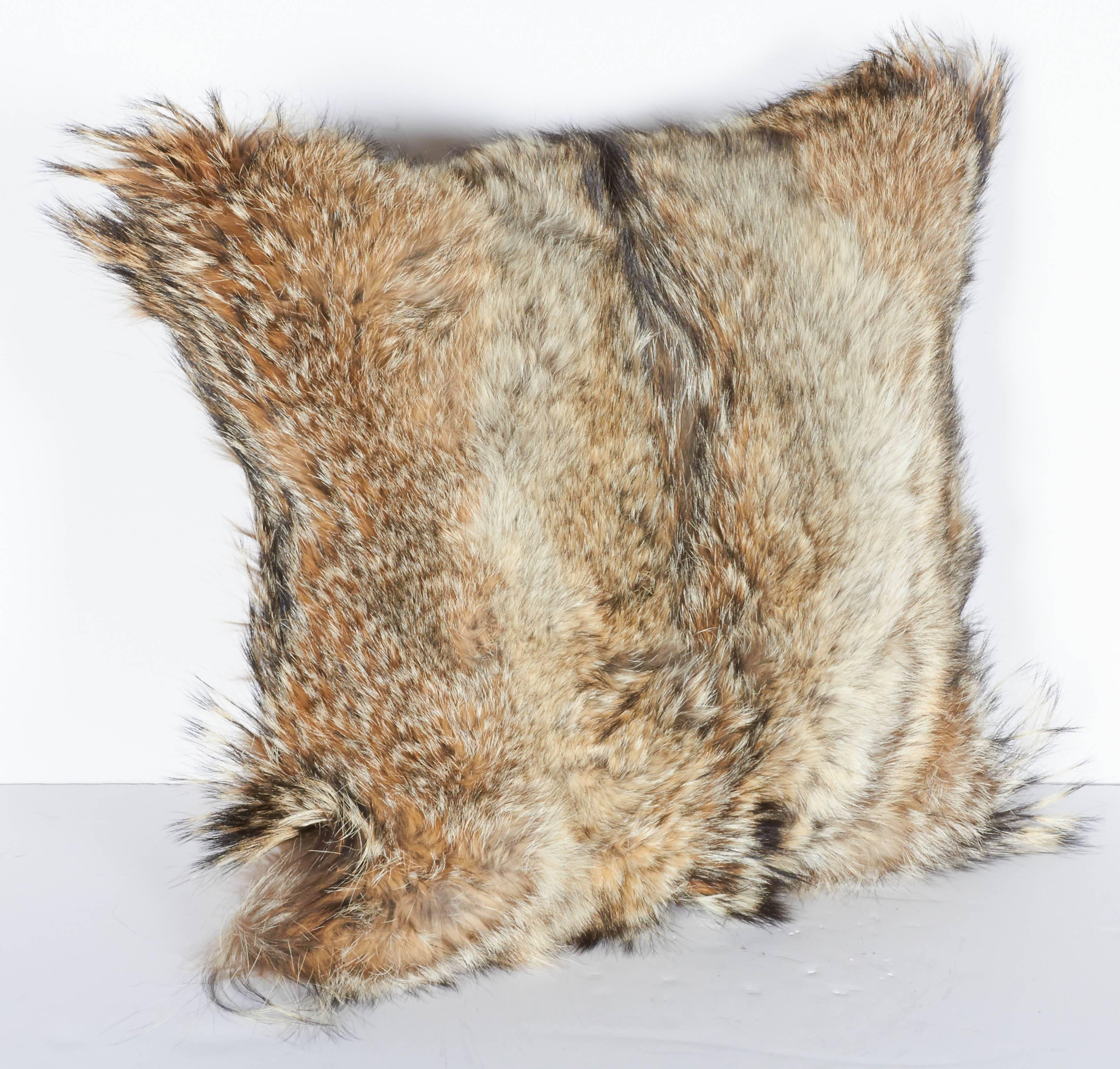 Custom made ultra luxe decorative pillows handcrafted from coyote fur in hues of, tan, camel, ivory and brown, with the occasional black streaks. Each pillow is unique in coloration and texture, and features hand-stitched backing in fine khaki
