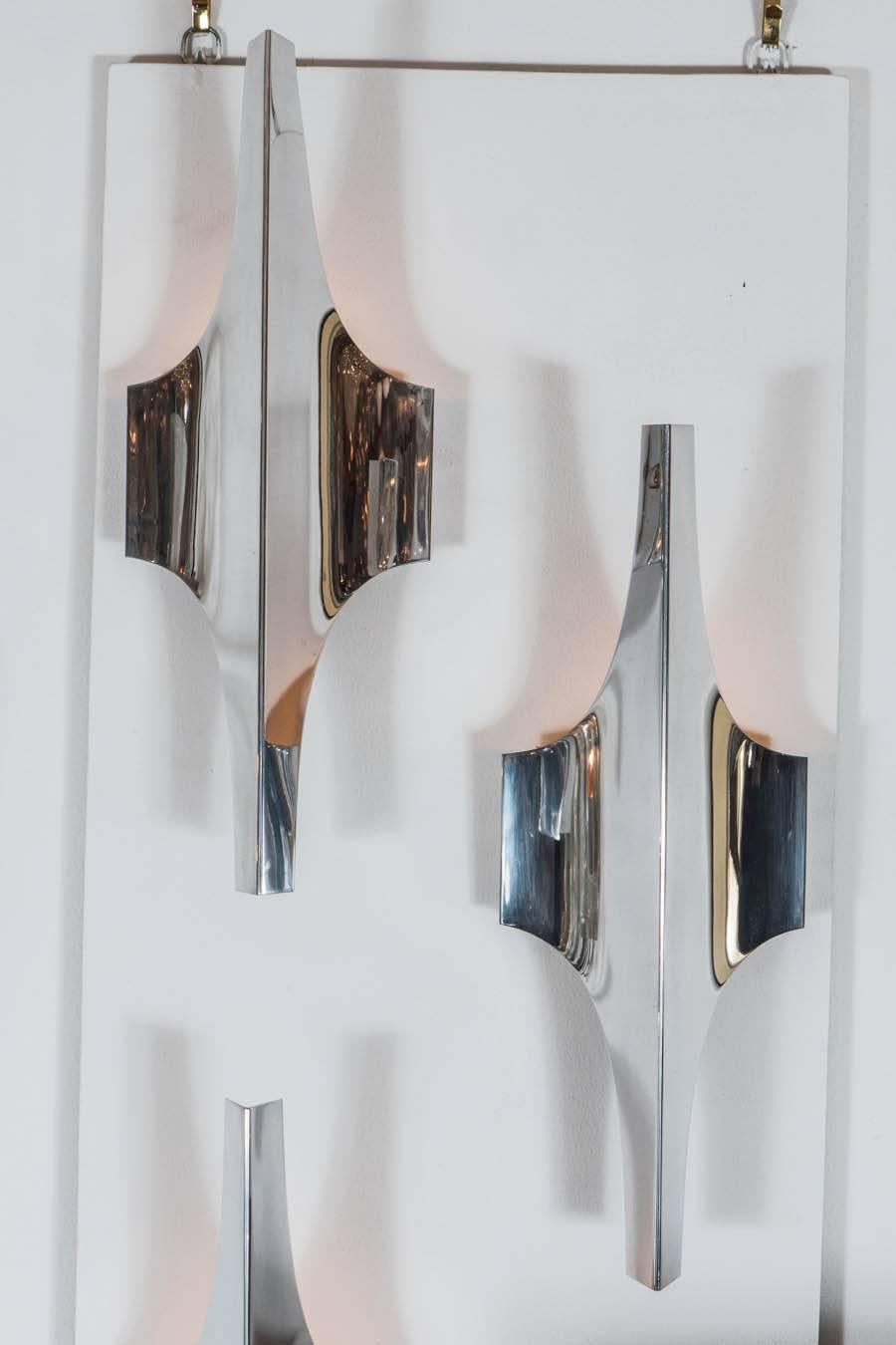 Pair of chrome modernist sconces in the style of Sciolari.