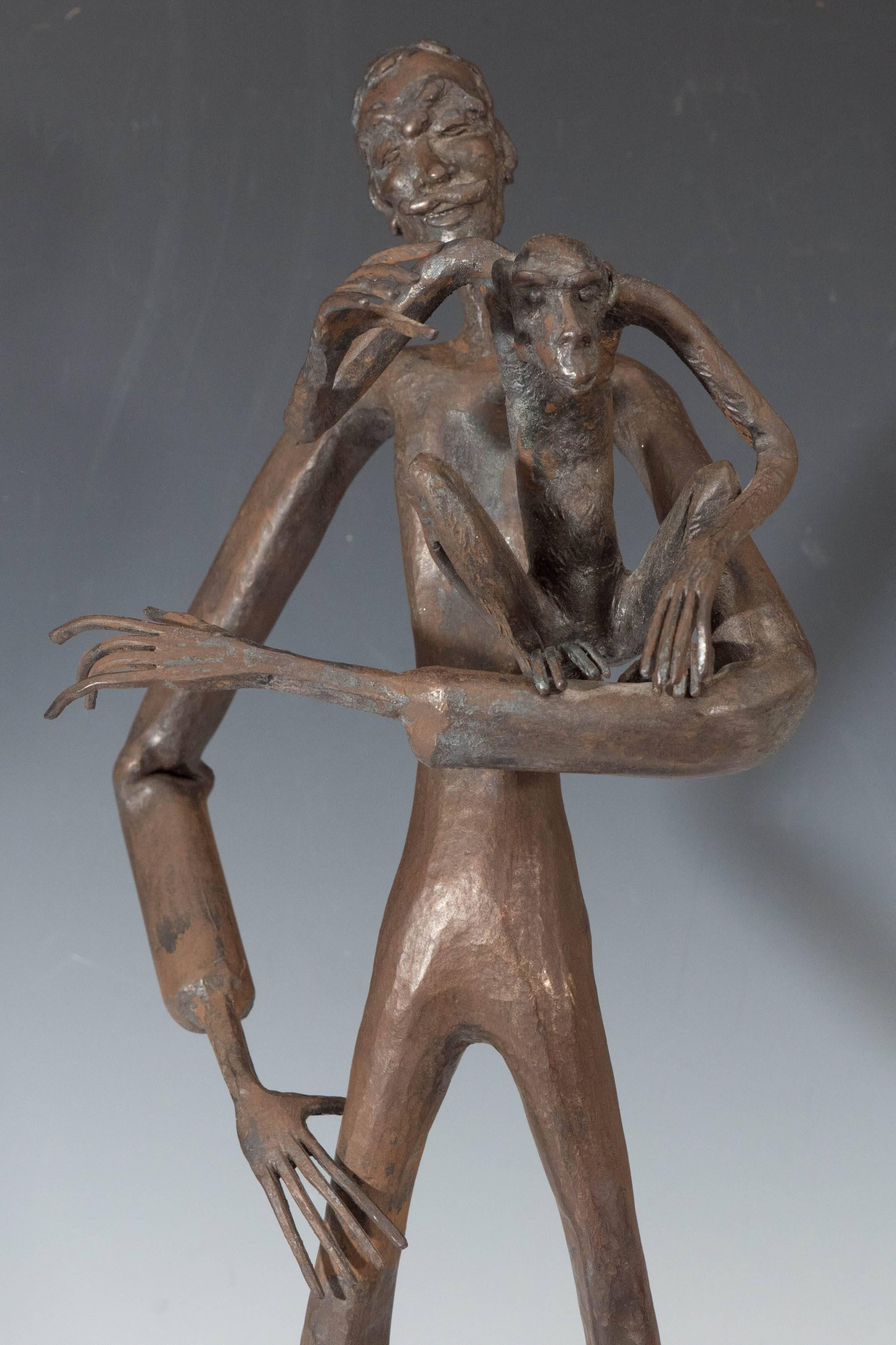 A vintage bronze sculpture, rendered in the Expressionist style, by French sculptor and ‘forgeron d'art’ (art blacksmith) Jean Marc of Cordes-sur-Ciel, created in 1961, which depicts a lanky man with a monkey on his arm. Very good condition,