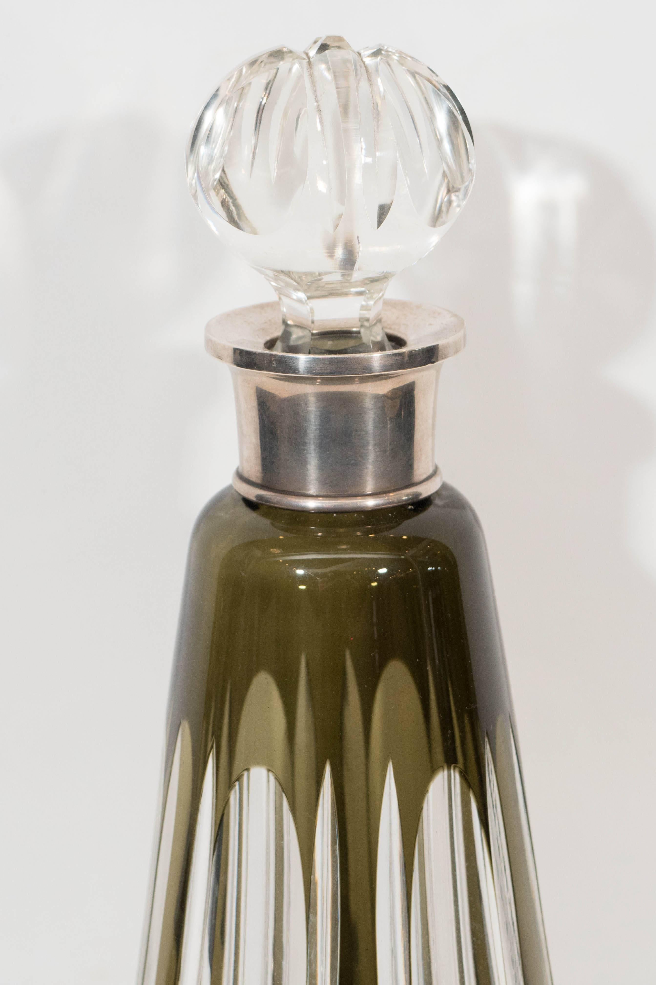 An Argentinian cut crystal decanter with black overlay, produced circa 1970s, including round, cut-glass stopper and sterling silver neck band. Markings include hallmarks, indicative of Industria Argentina [IN.ARGENTINA] and sterling silver