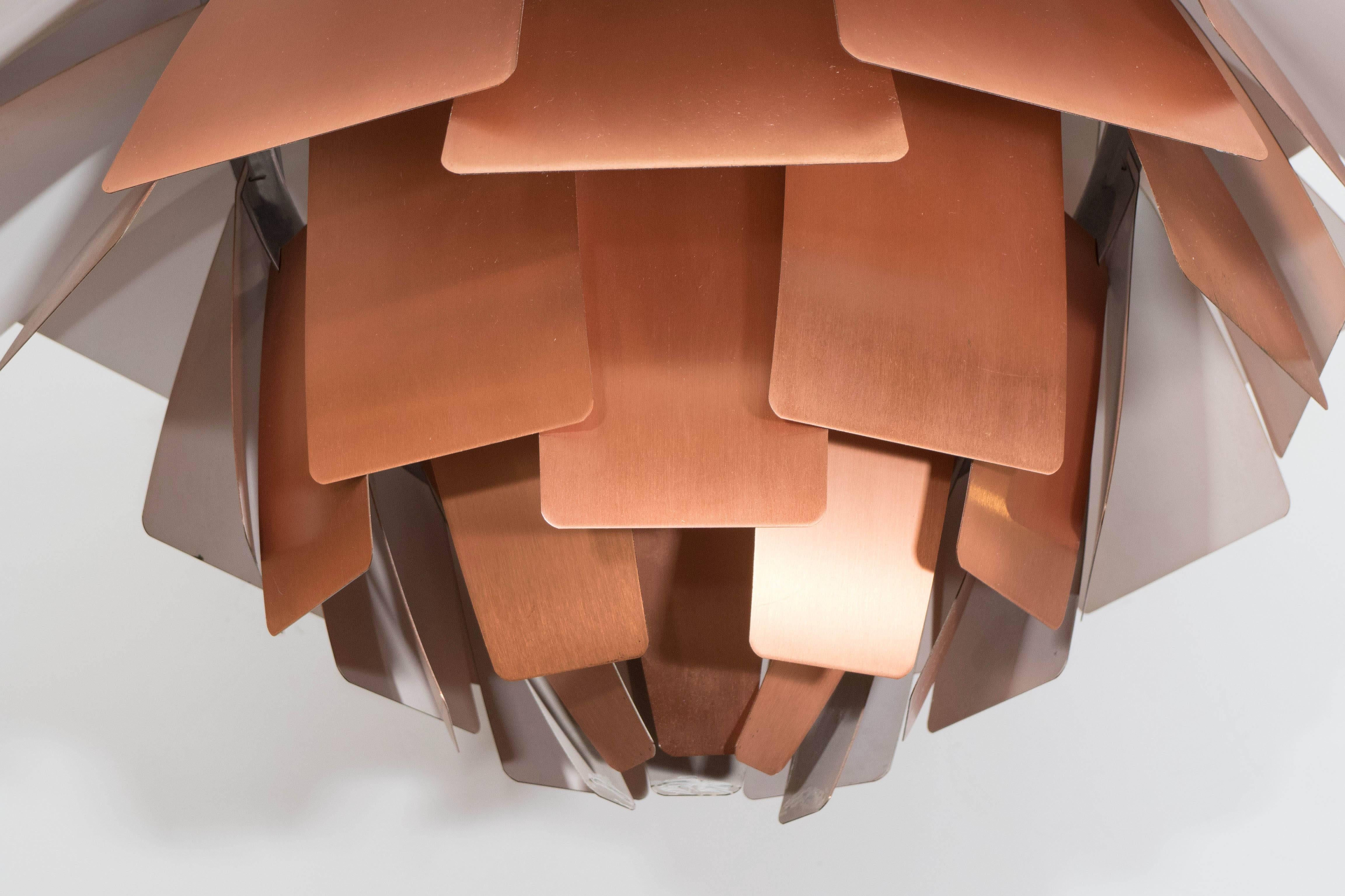 This superb Scandinavian Modern 'Artichoke' lamp pendant light, designed by Poul Henningsen in 1958 for Louis Poulsen of Denmark, includes a central diffuser in polished chrome, surrounded by panels of brushed copper, the underside coated in white