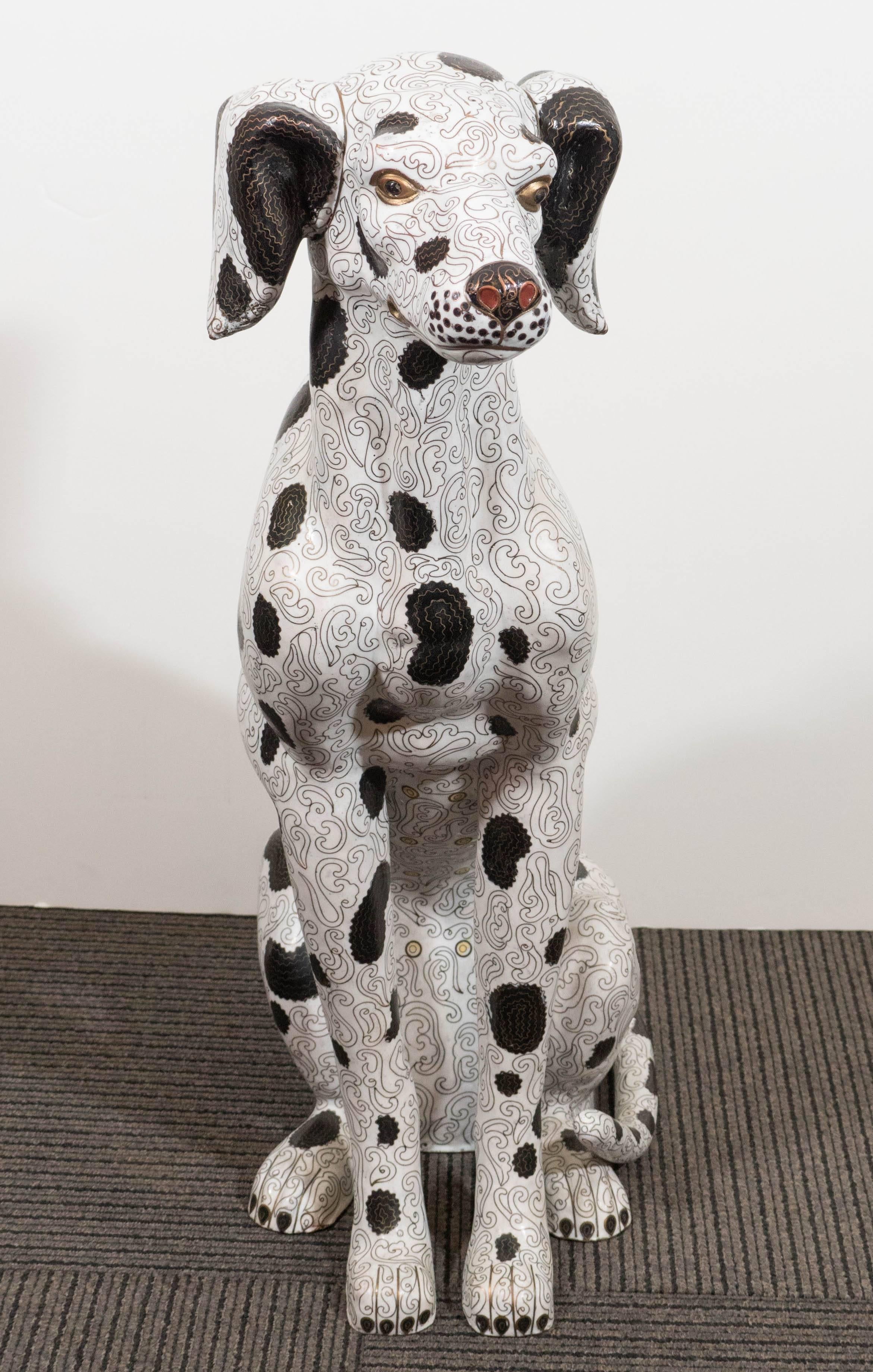 This Chinese cloisonne sculpture of a Dalmatian dog comes in cast bronze, decorated with scrolling designs against a white ground and stylistic black spots, with painted detail to the eyes and face. Overall good condition, with age appropriate wear