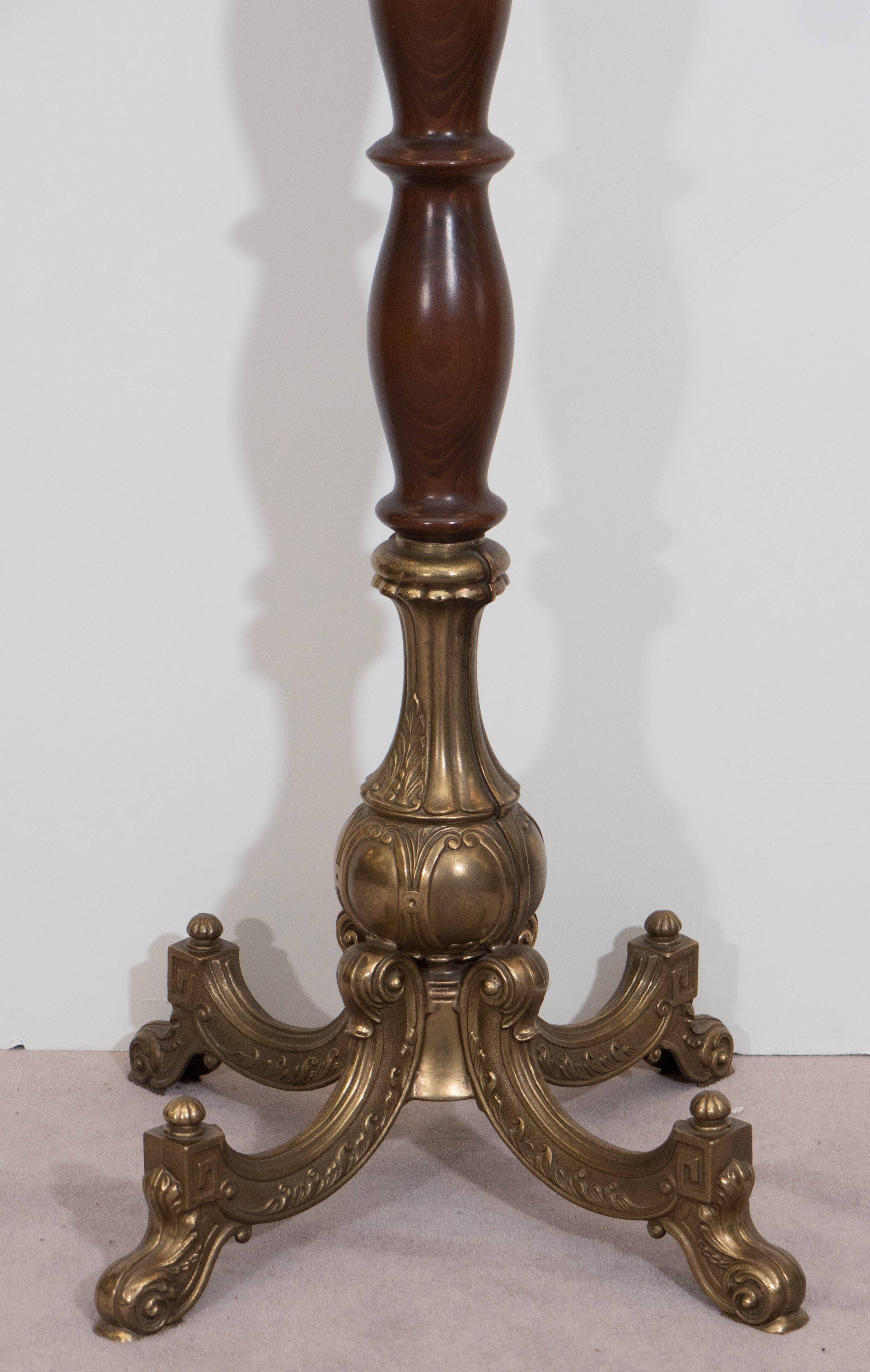 An elegant Italian coat rack, produced, circa 1910, with a turned baluster wood stem, which includes eight coat hooks and four purse hooks in bronze, beautifully detailed, evoking classical style and design. Very good vintage condition, with age