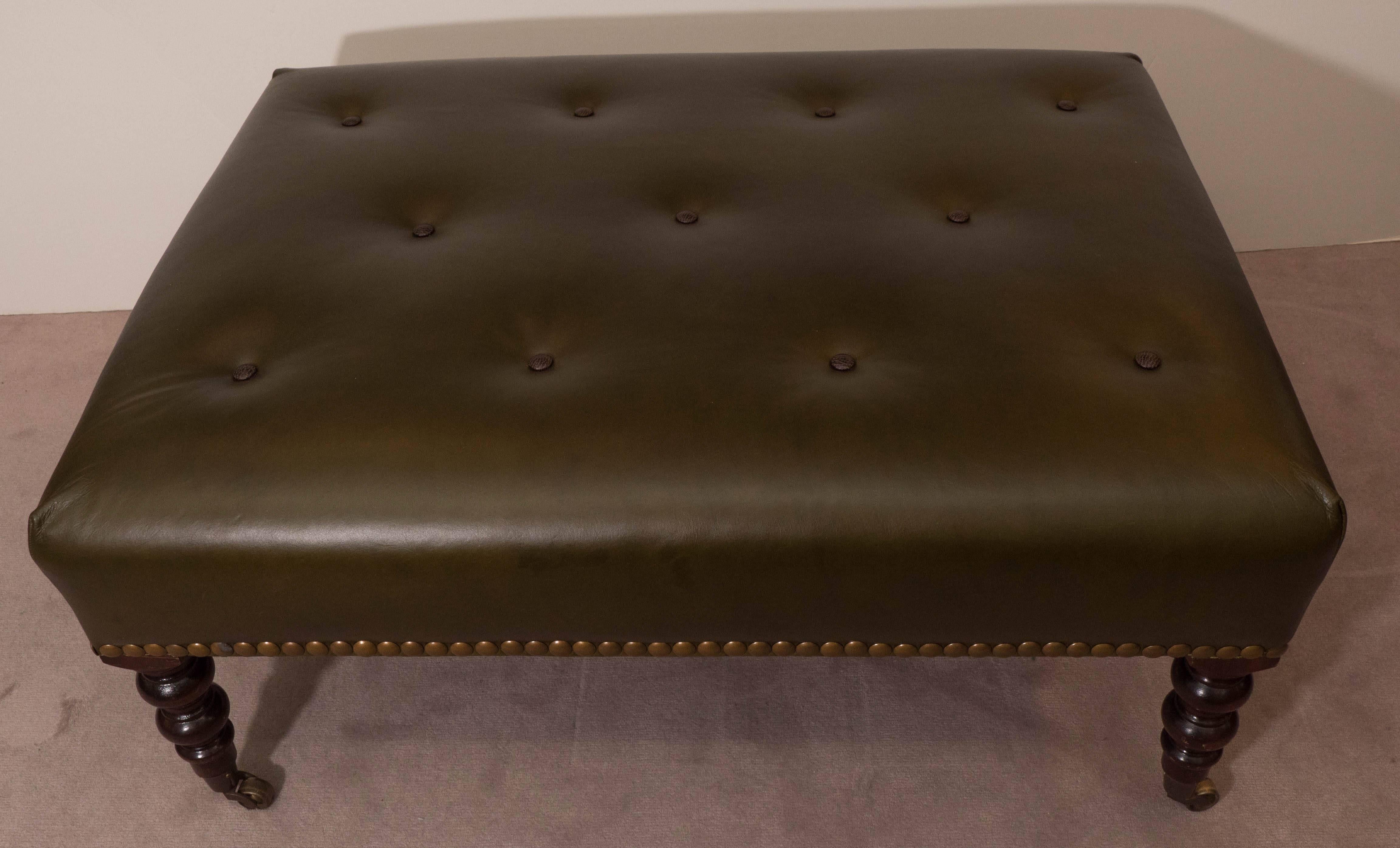 green leather ottoman
