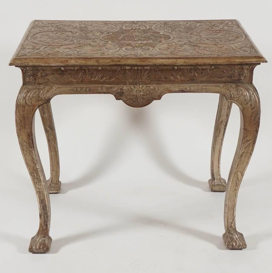 Exceptional and exceptionally rare late Queen Anne, George I period rectangular form pier table having original silvered (white gold leaf) gesso finish with incised top having central spread-winged eagle on cloud surrounded by punchwork, foliate,