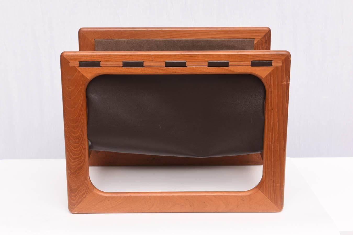 Beautiful teak and leather magazine rack. Wonderful vintage condition. Made in Denmark, 1960s.