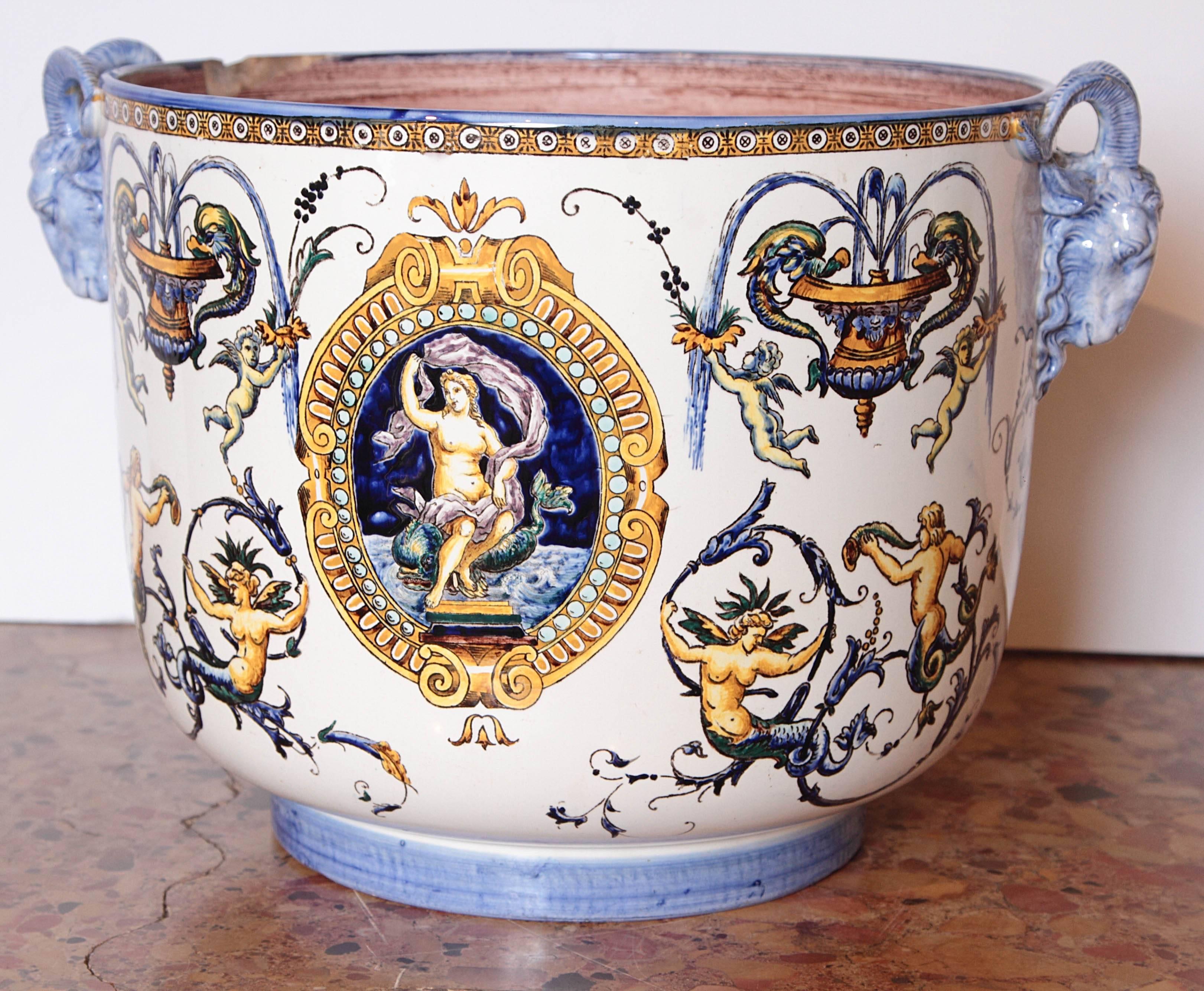 This antique French faience Jardiniere by Gien has the white ground color of a pattern called Renaissance, manufactured during the time period of 1860-1871. Faience is tin glazed earthenware that allows pigments to be applied in numerous