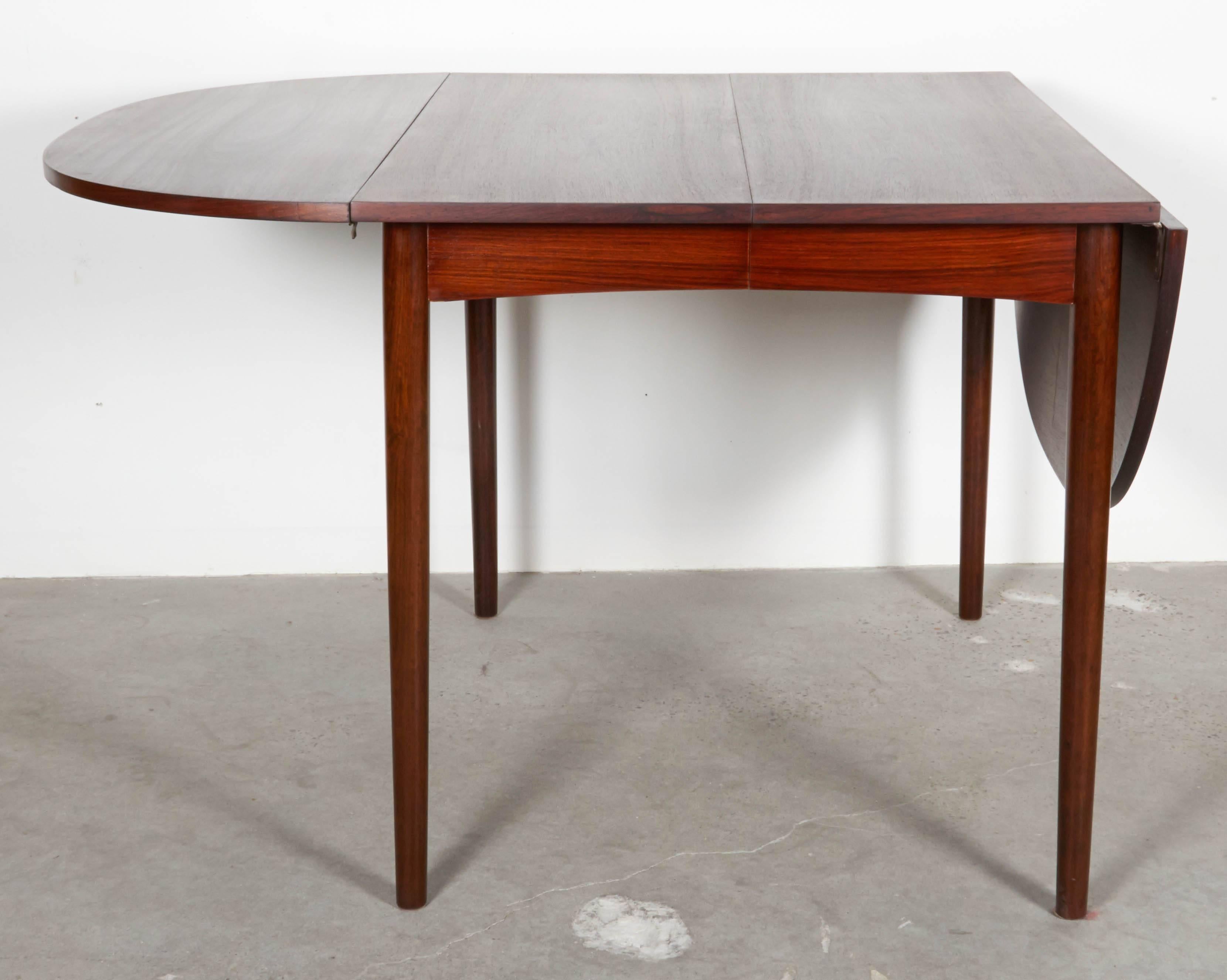 Vintage 1960s Rosewood Dining Table with Drop Leaves

This Vintage Dining Table can break down to 29