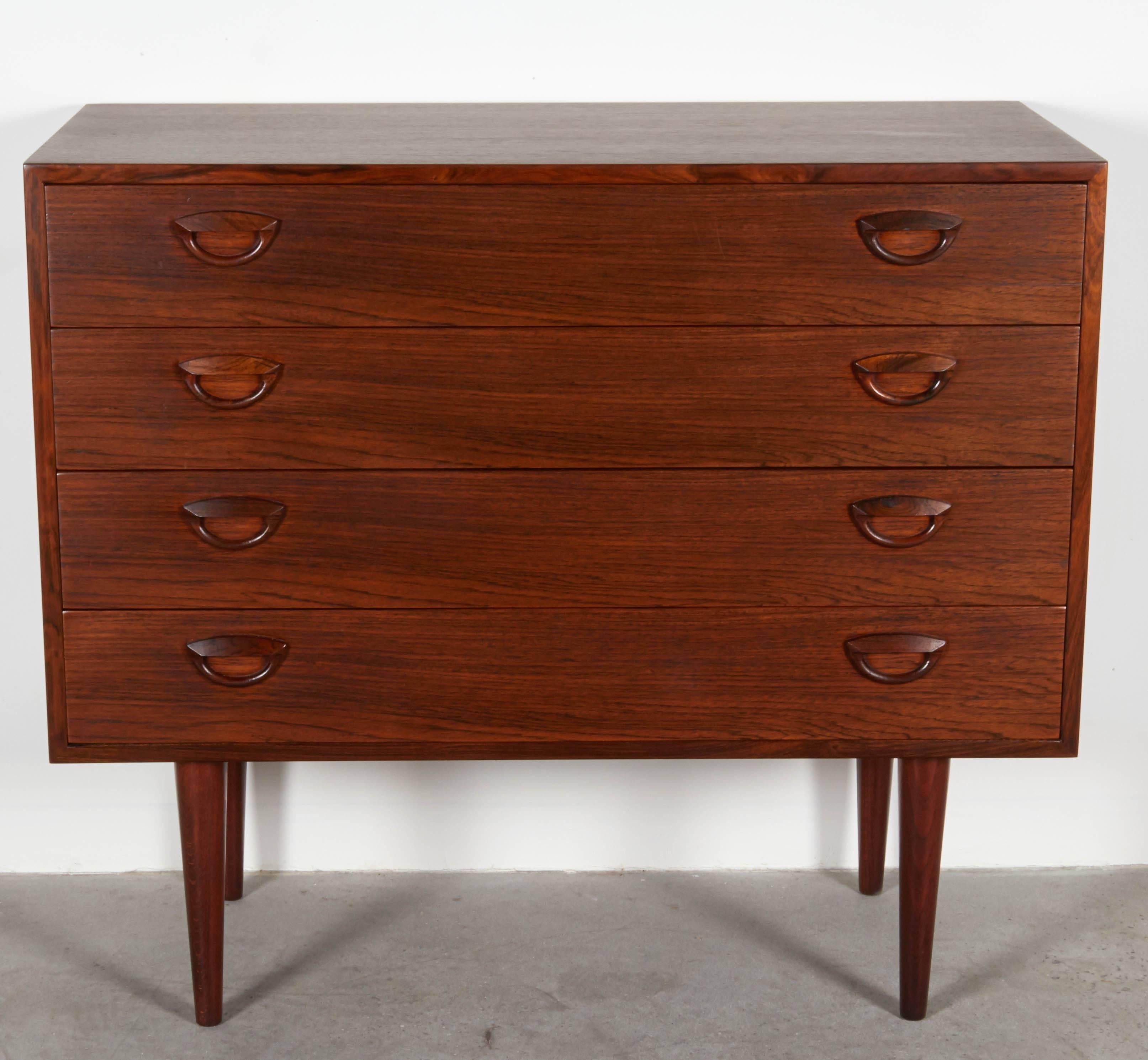 Vintage 1960s Chest of Drawers in Rosewood by Kai Kristiansen

This 4 drawer dresser is in like new condition. This chest works in many parts of the home as an extra dresser or large night stand in the bedroom. Great in the hallway or  entryway