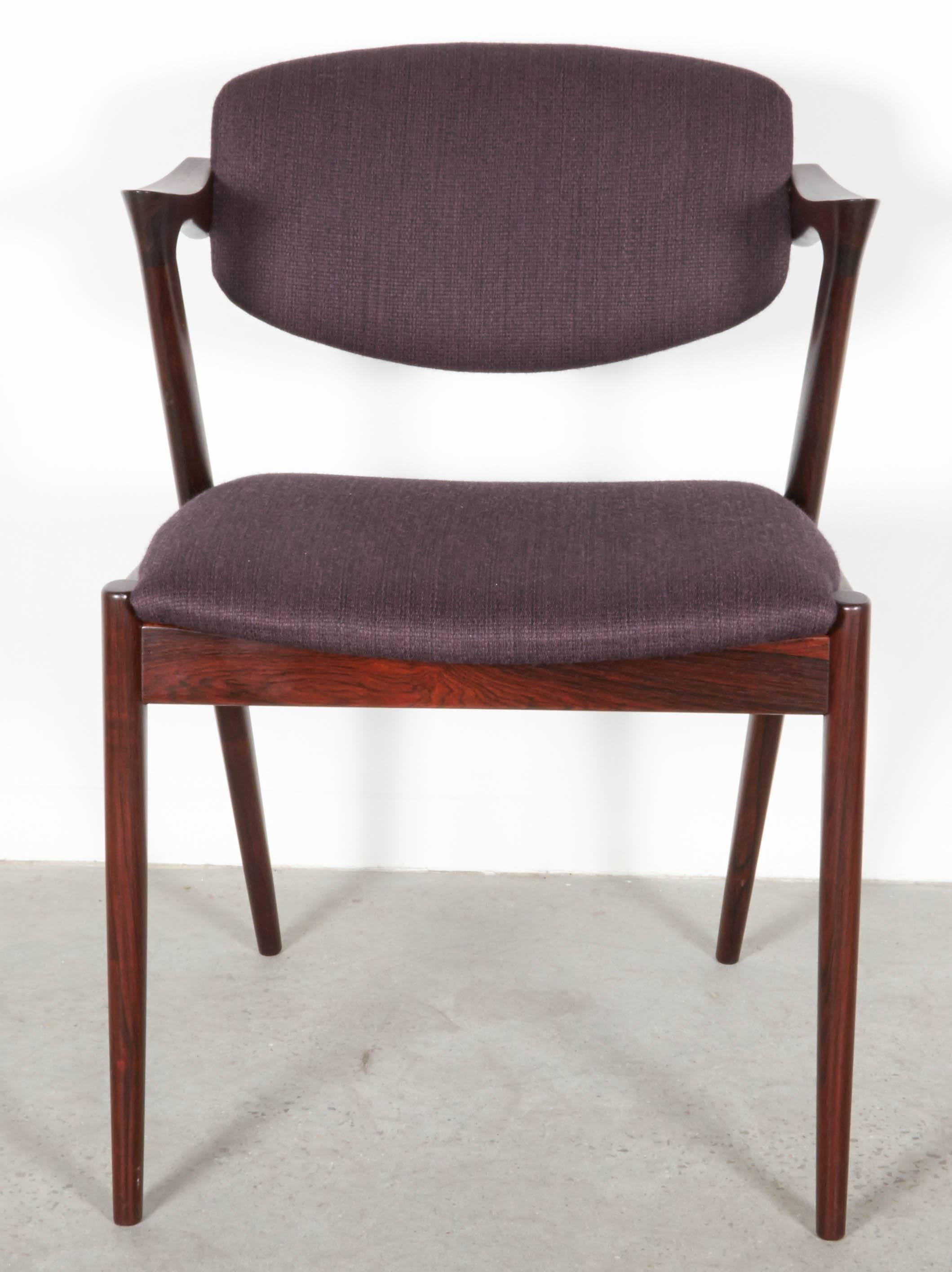 Vintage 1950s Rosewood Danish Dining Chairs by Kai Kristiansen.

These vintage side chairs are in like-new condition. The swivel back that adjust to your back makes it like a little lounge chair at the dining table. The most comfortable dining