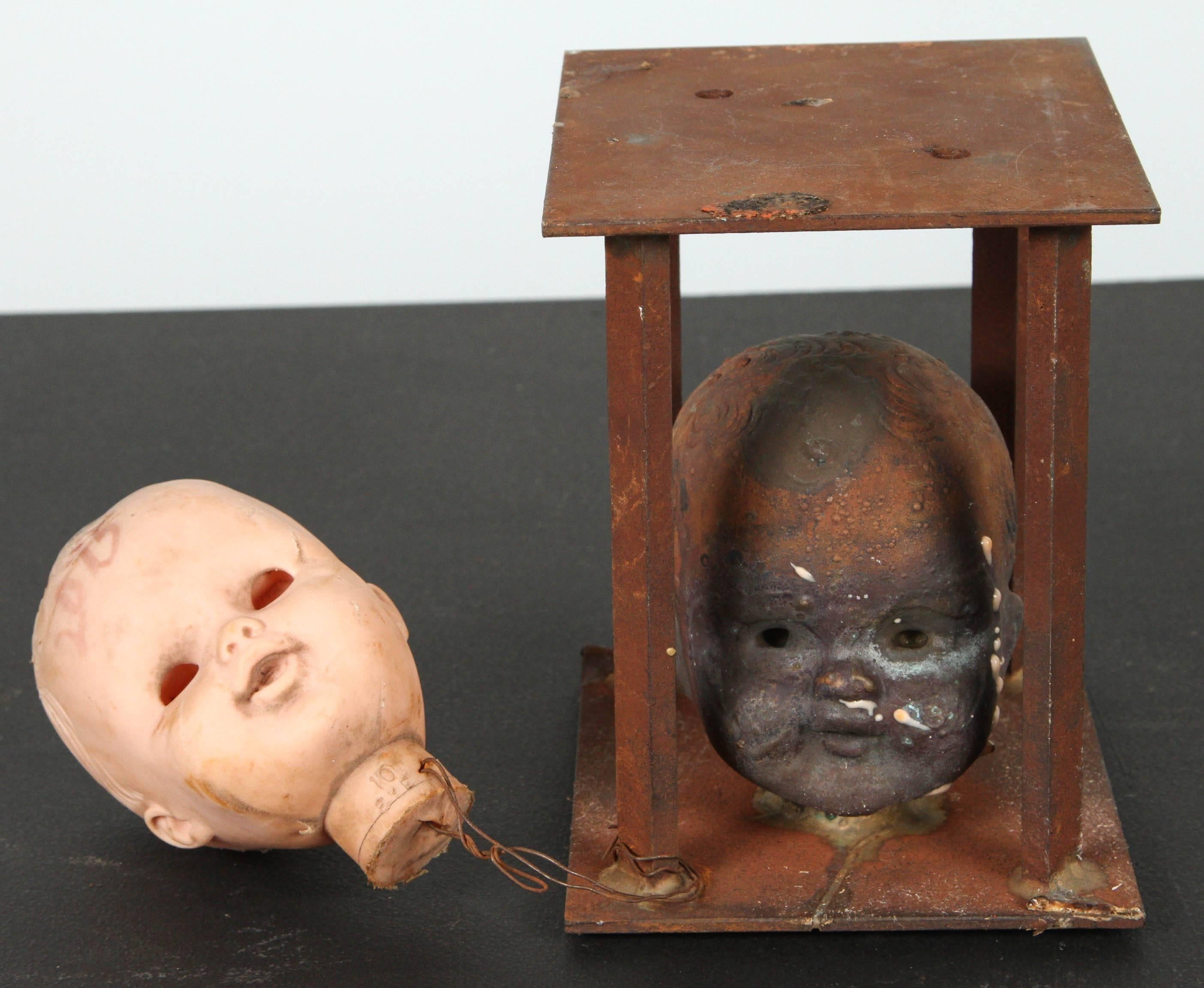 Vintage Bronx toy factory industrial doll head mold with original production plastic latex doll head attached. Fantastic patina and layered surface from exposure to various chemicals and high heat during the manufacturing process. Shipping may take