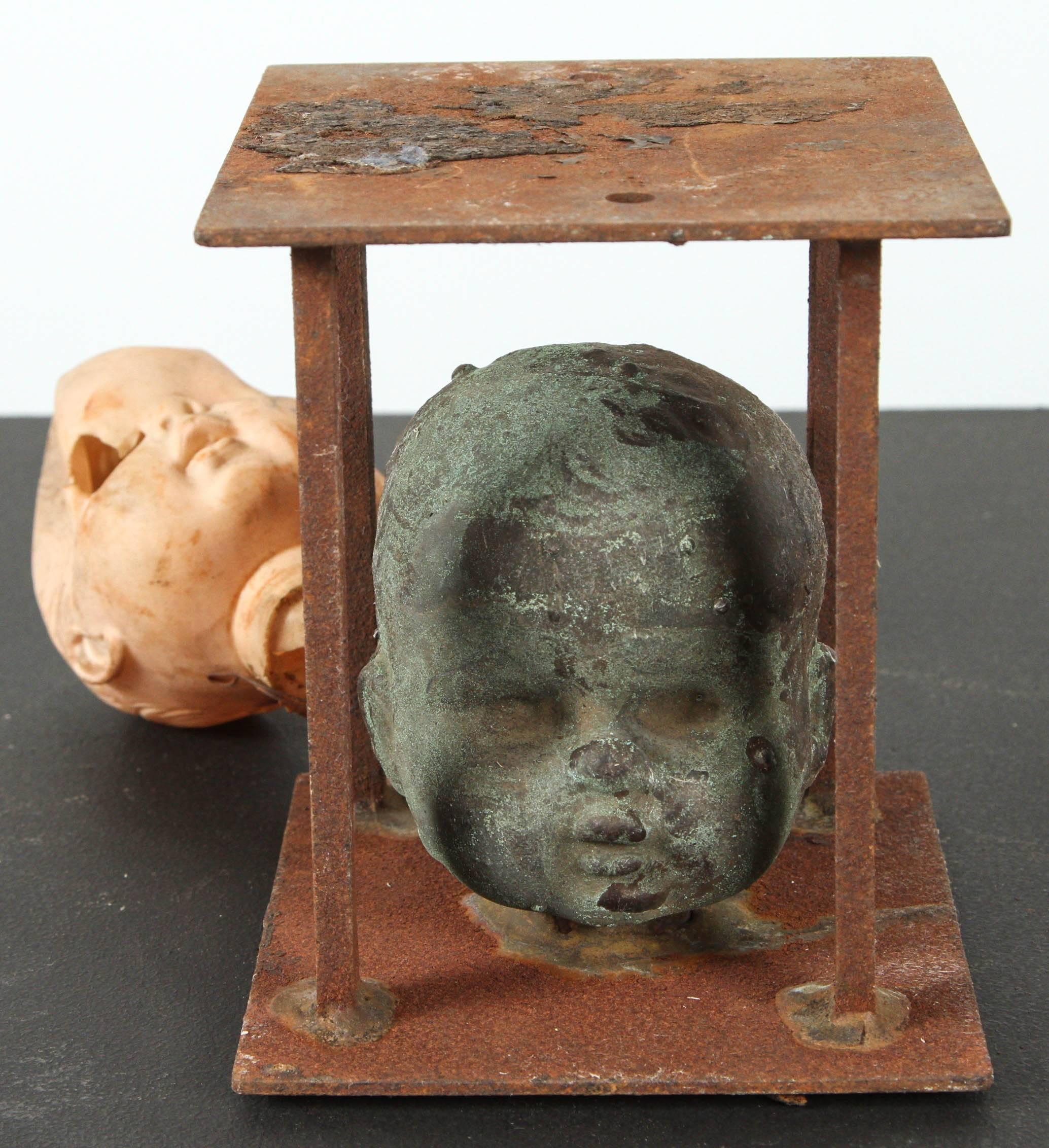 Vintage Bronx toy factory Industrial doll head mold with original production plastic doll head attached. Fantastic patina and layered surface from exposure to various chemicals and high heat during the manufacturing process. Please note that this is