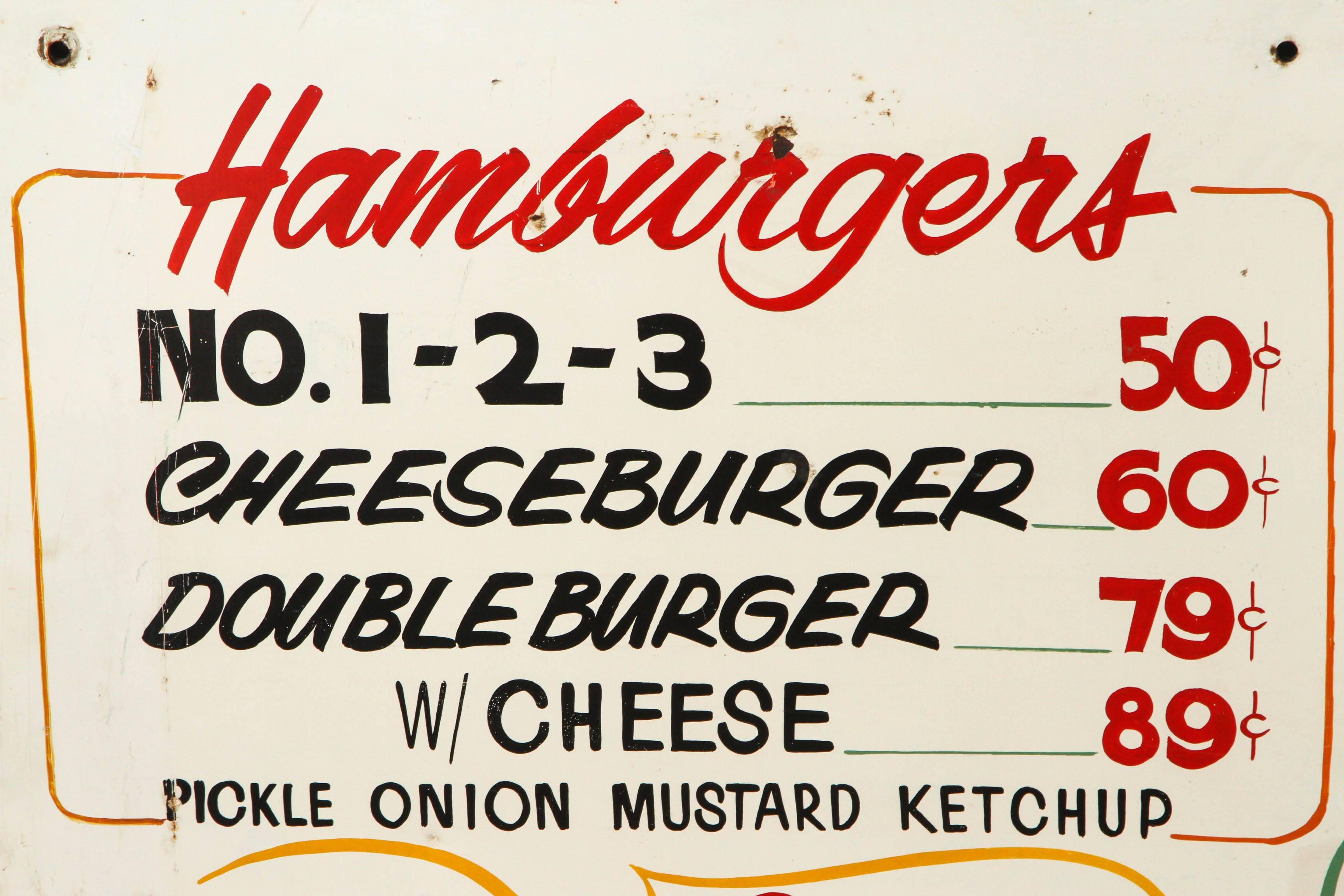 Home of the super burger, Sasquatch and Hot Shot! Graphic drive-in menu board found in the Pacific northwest. Metal sign with original wood frame attached to the back.