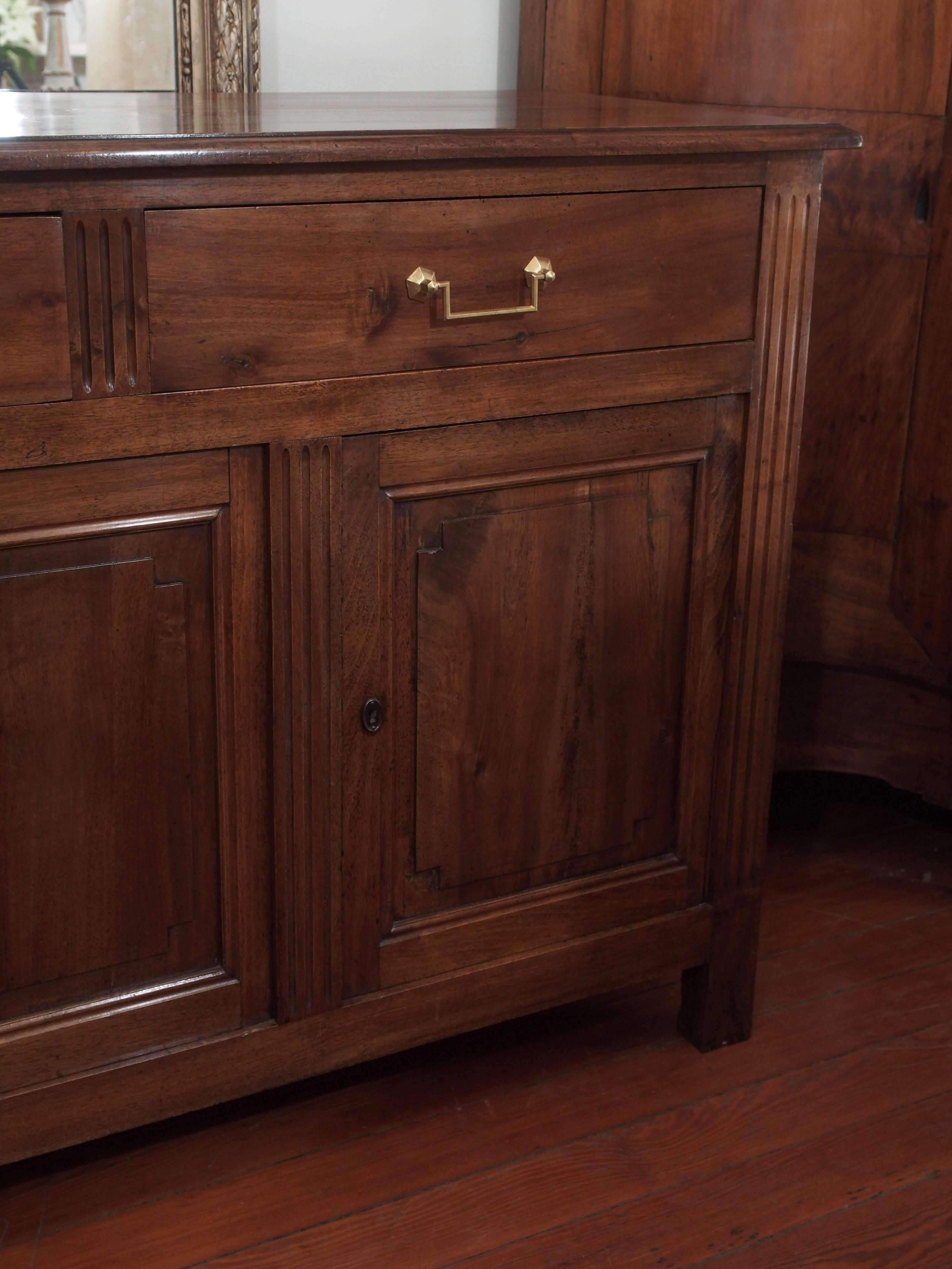 Period walnut Directoire enfilade with four doors and three drawers.