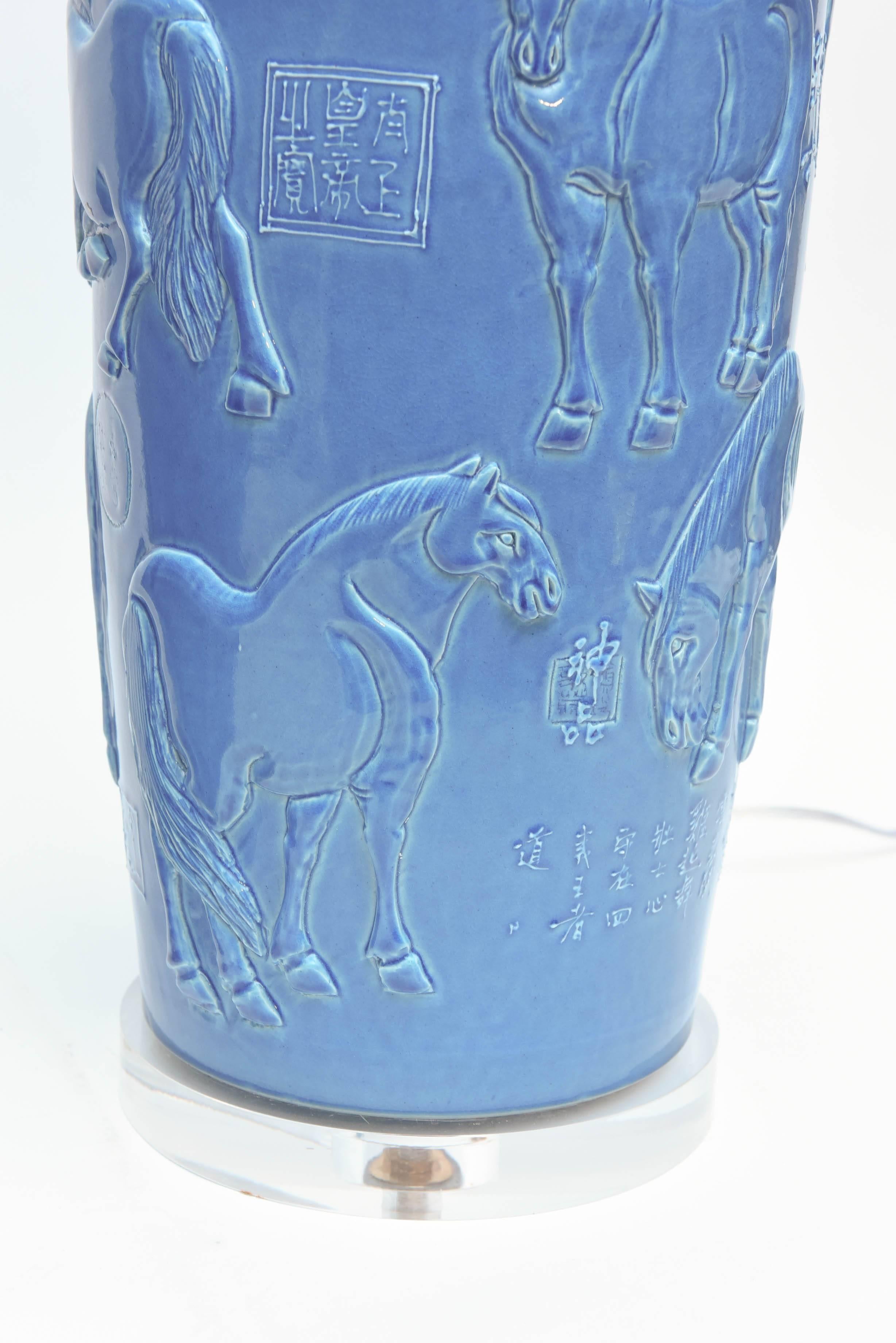 The pieces are decorated with figures of horses. The pieces are signed with extensive calligraphy - custom mounted on Lucite bases (shades excluded).